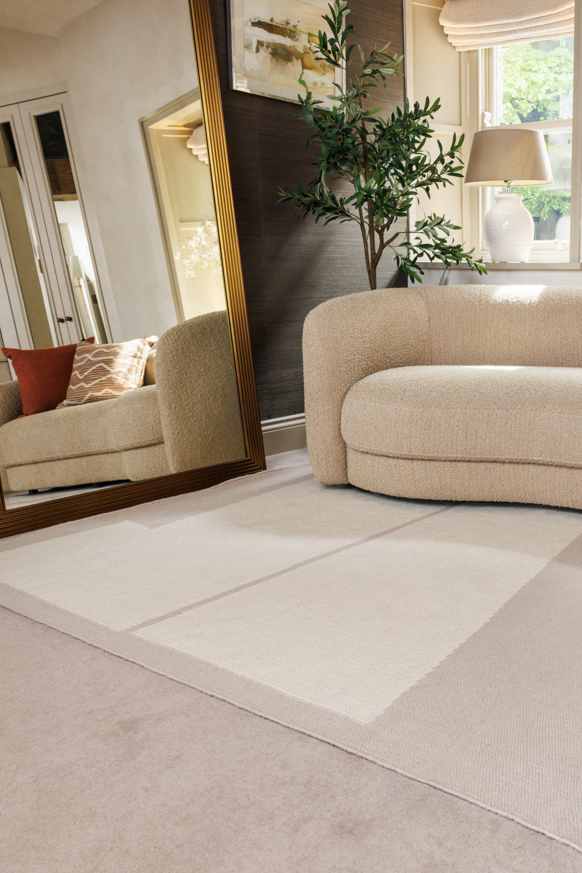 Neutral greige wool and cotton rug featuring an ivory angular design