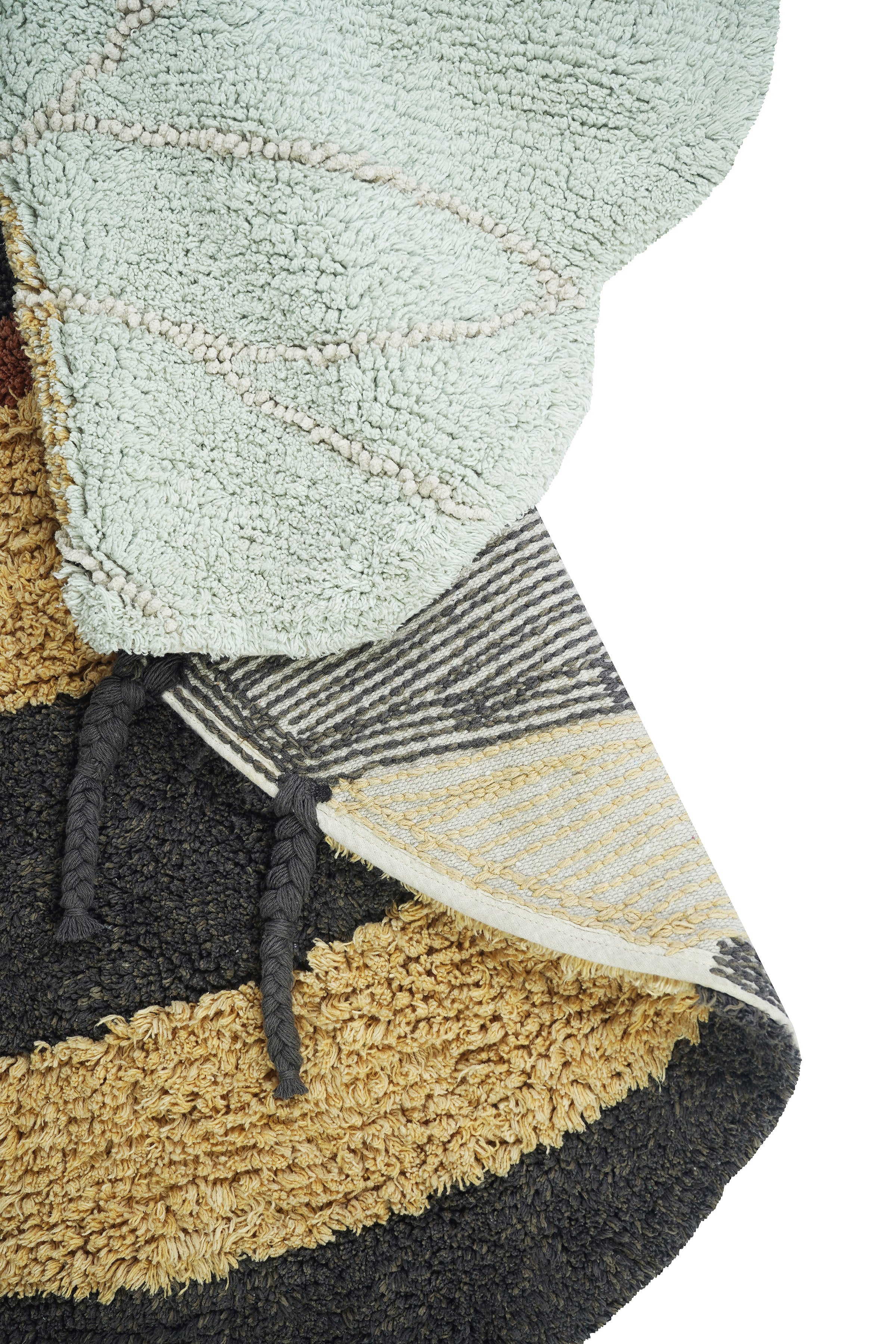 Bee-shaped rug with shades of gold, orange, brown, cream, and beige