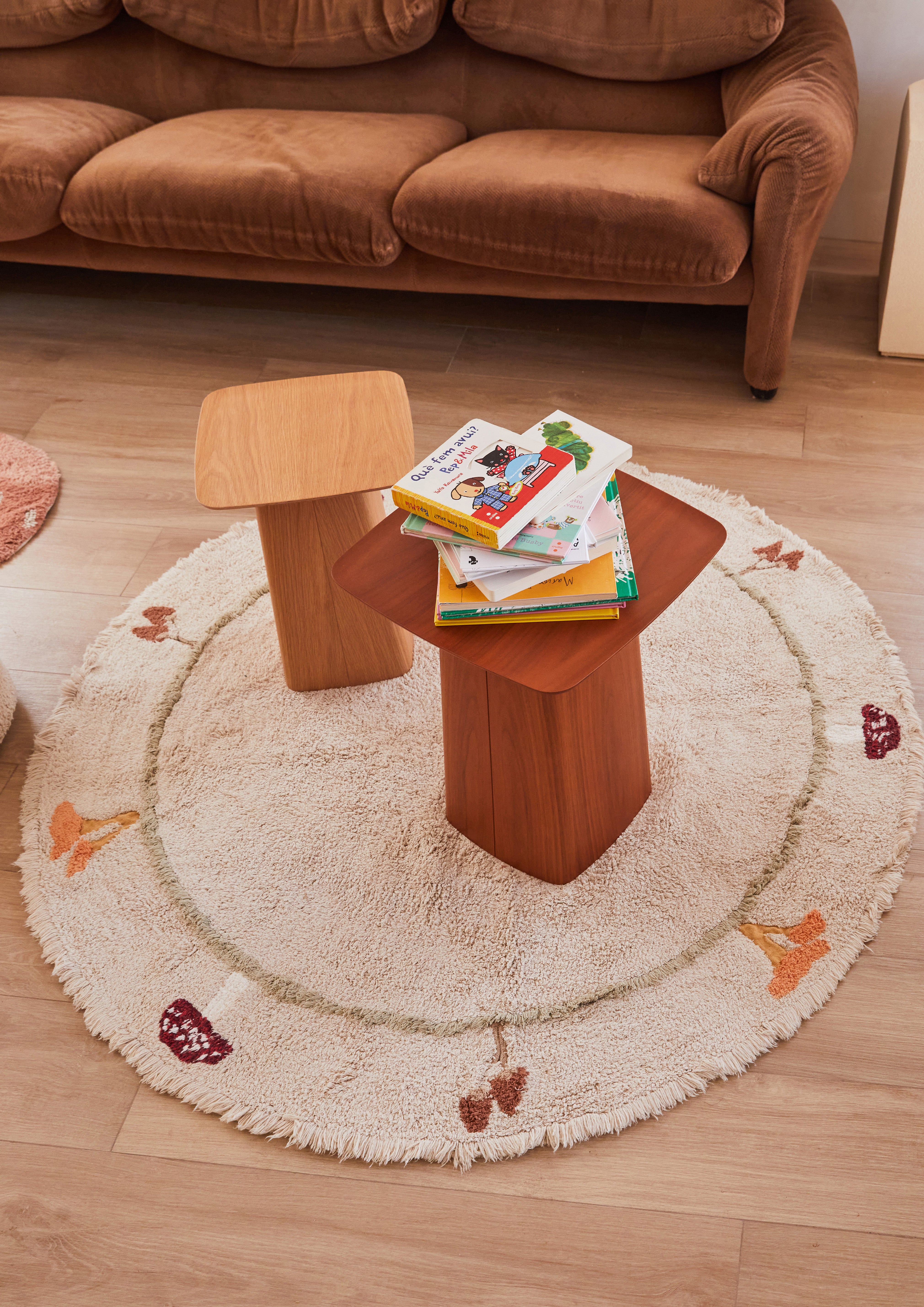 Round cream children's rug with mushroom border pattern