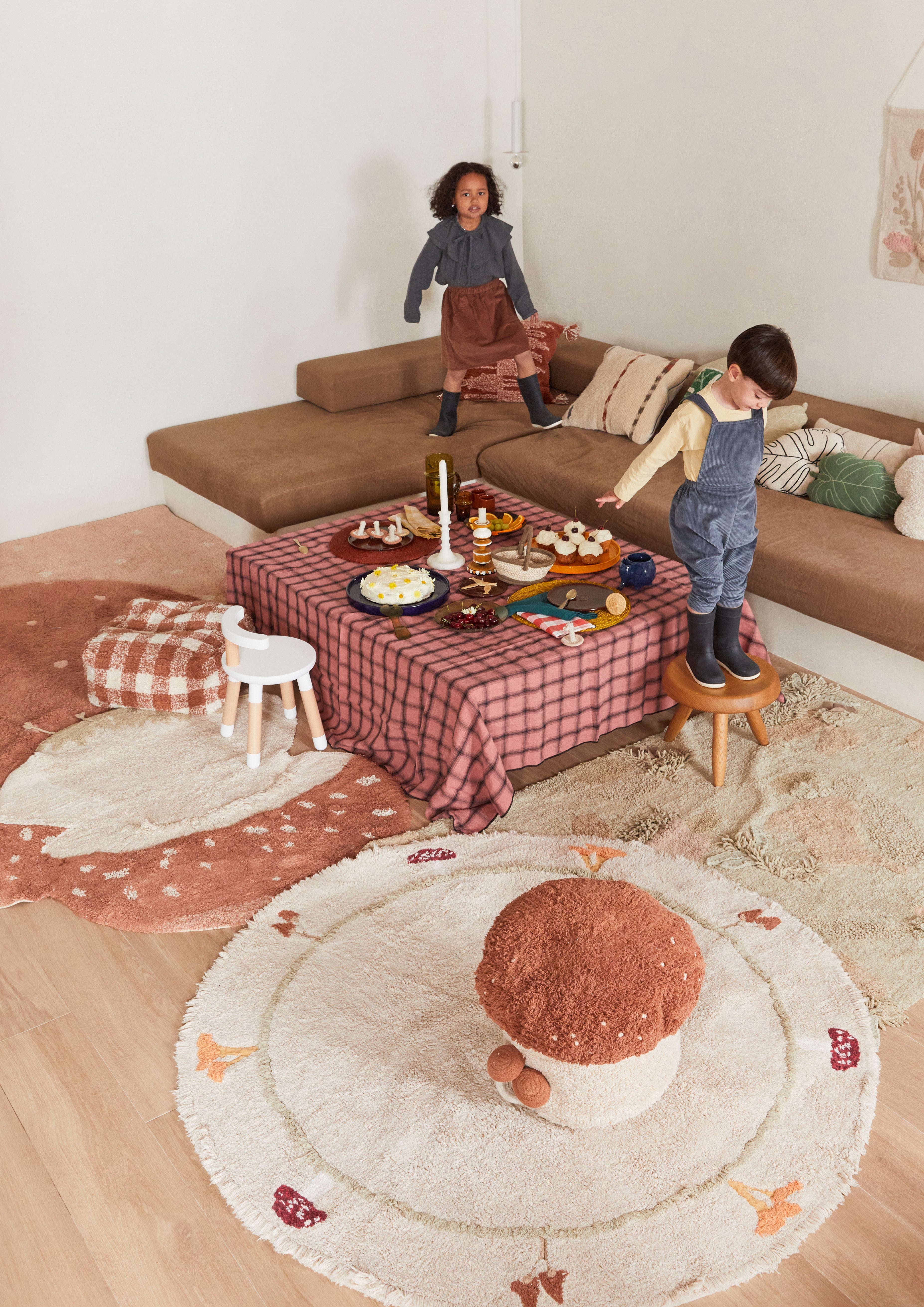 Round cream children's rug with mushroom border pattern