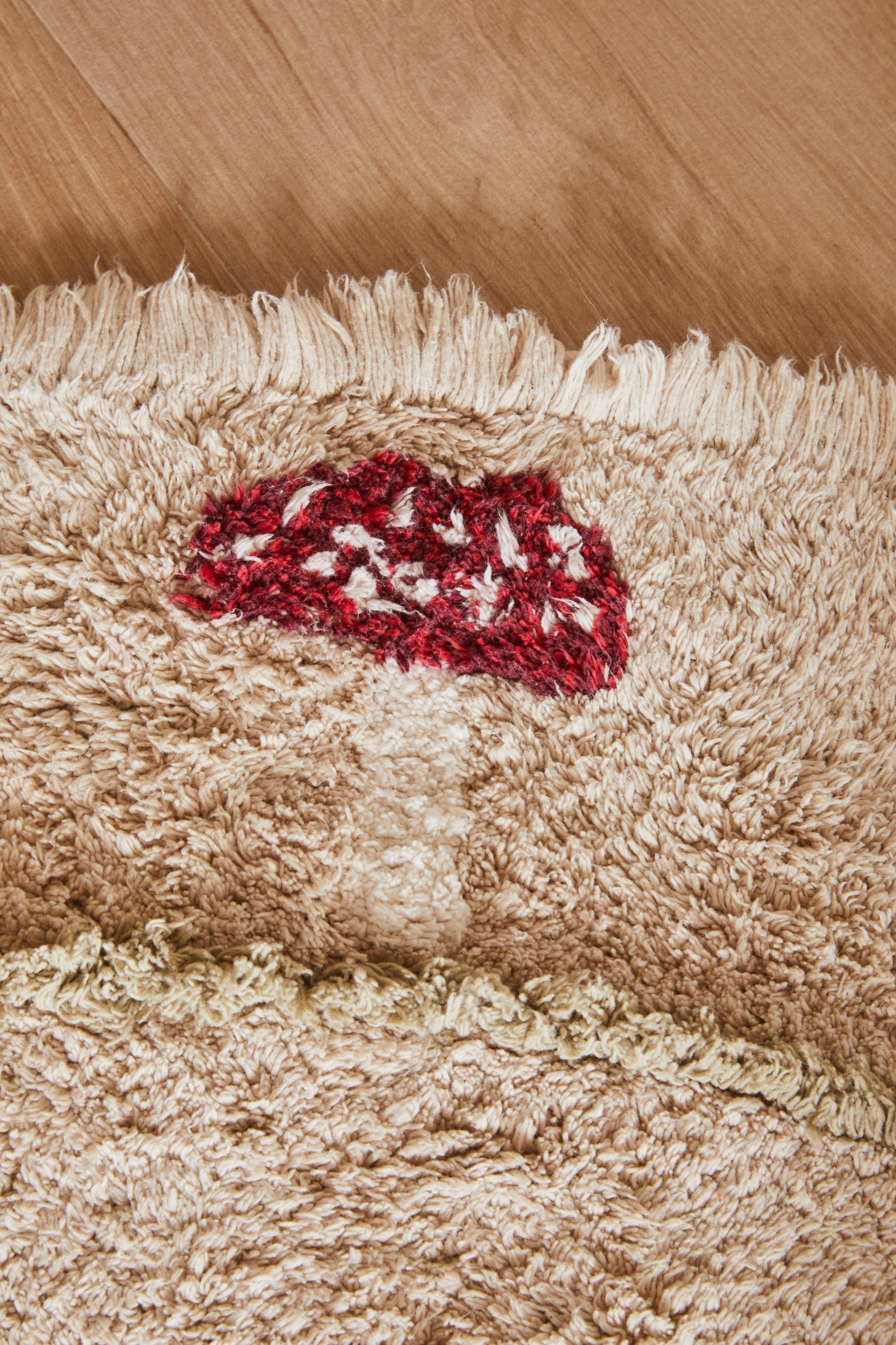 Round cream children's rug with mushroom border pattern