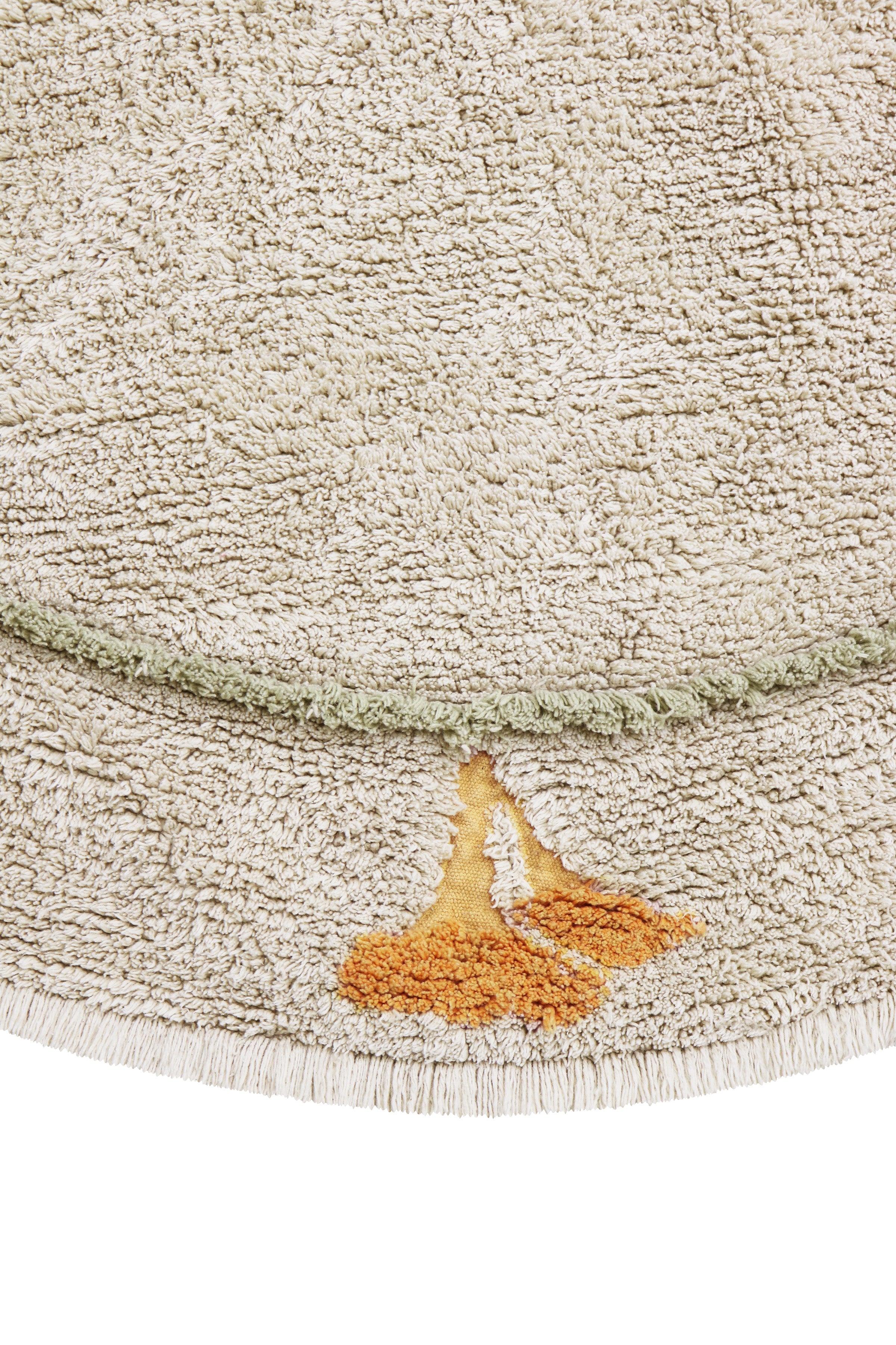 Round cream children's rug with mushroom border pattern