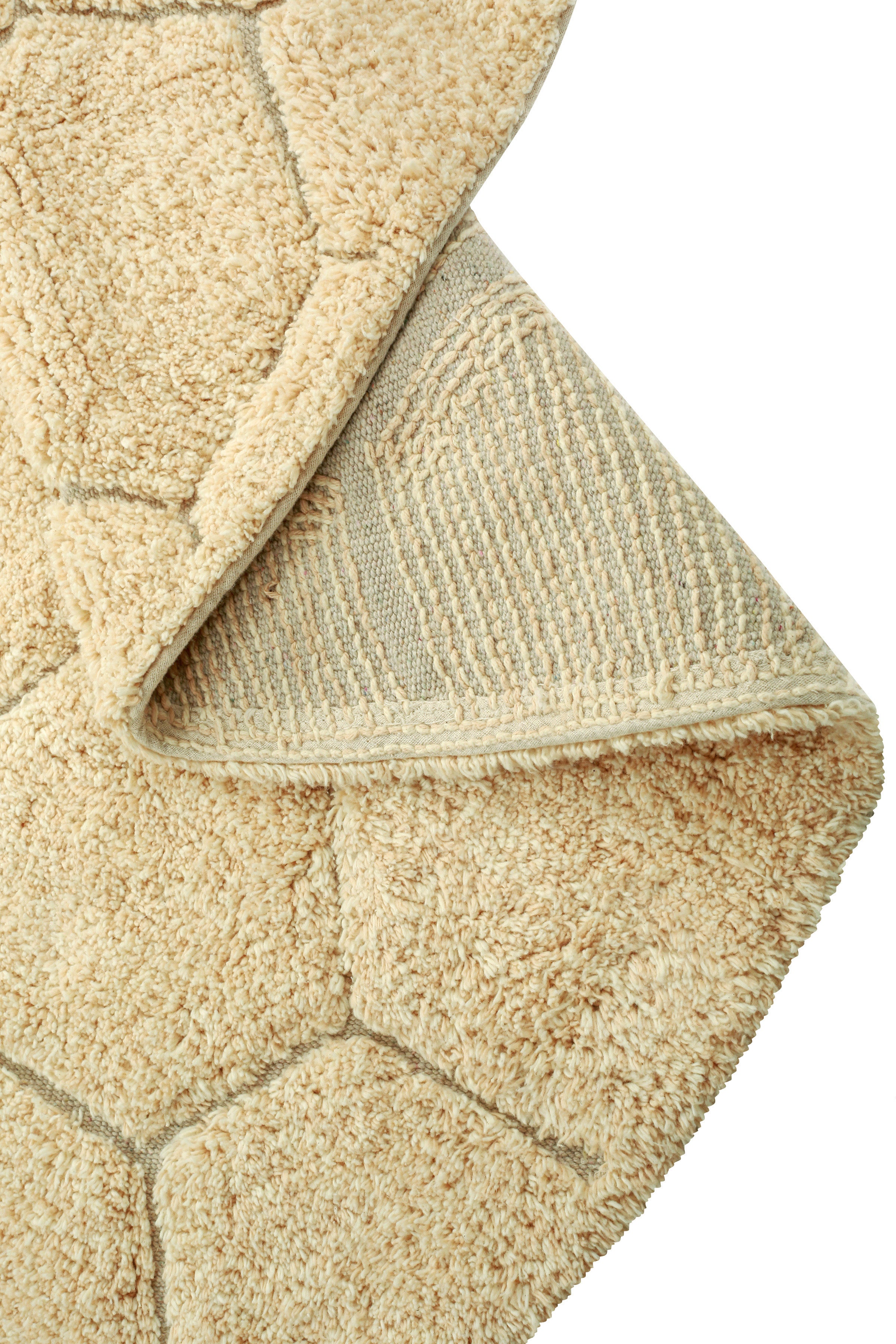 Round gold rug with honeycomb pattern