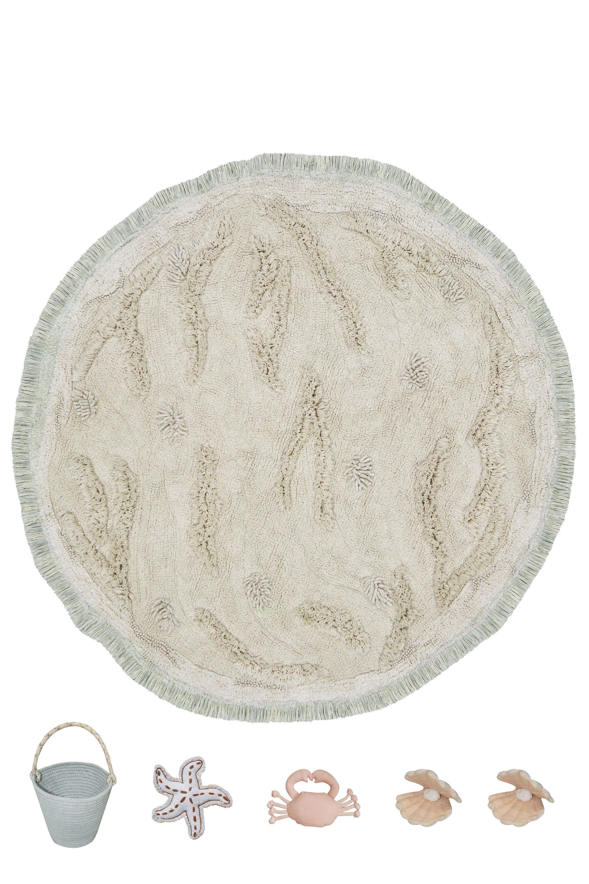 Beige island inspired rug with green fringing and added beach toys