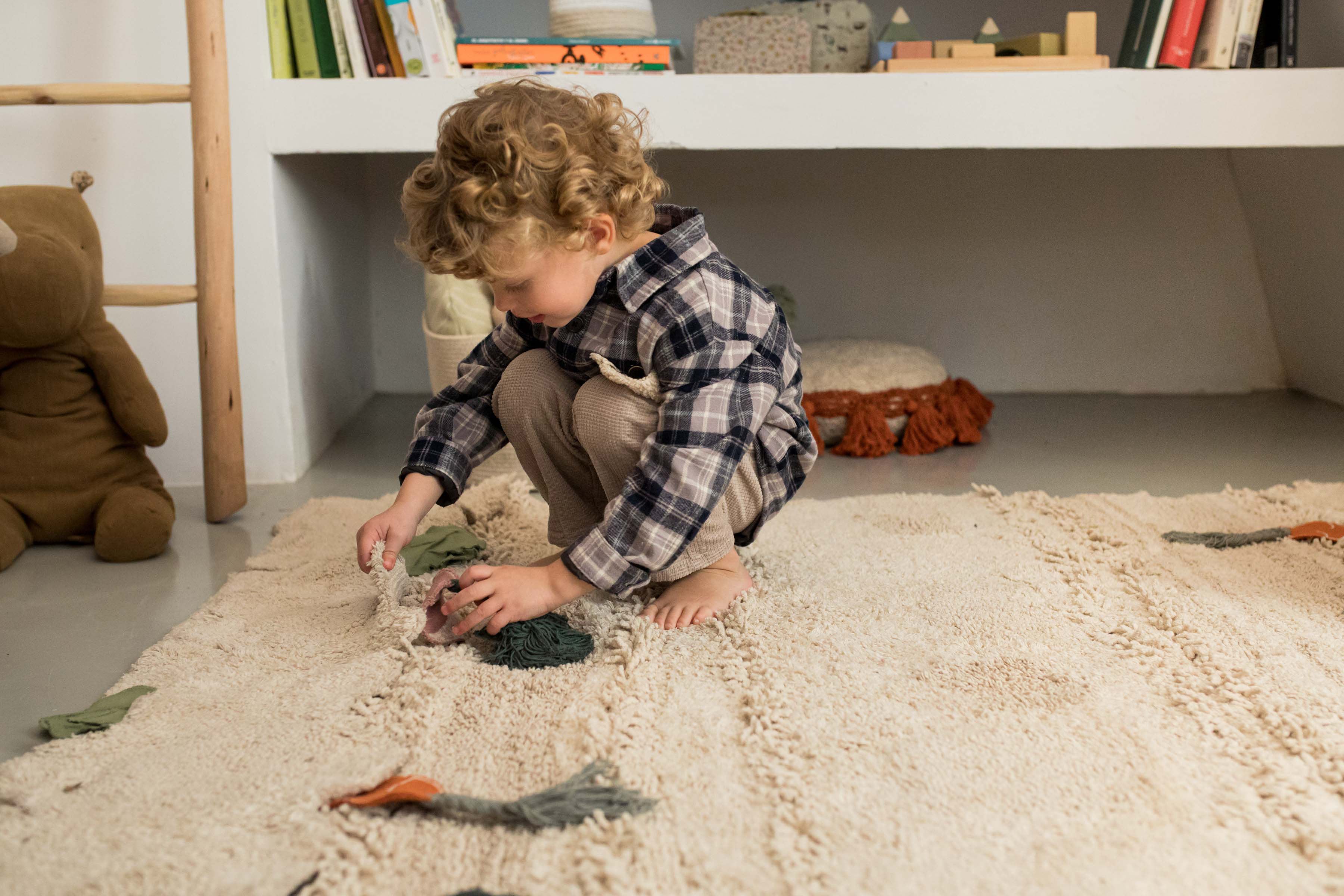 Green garden inspired rug with added vegetable toys