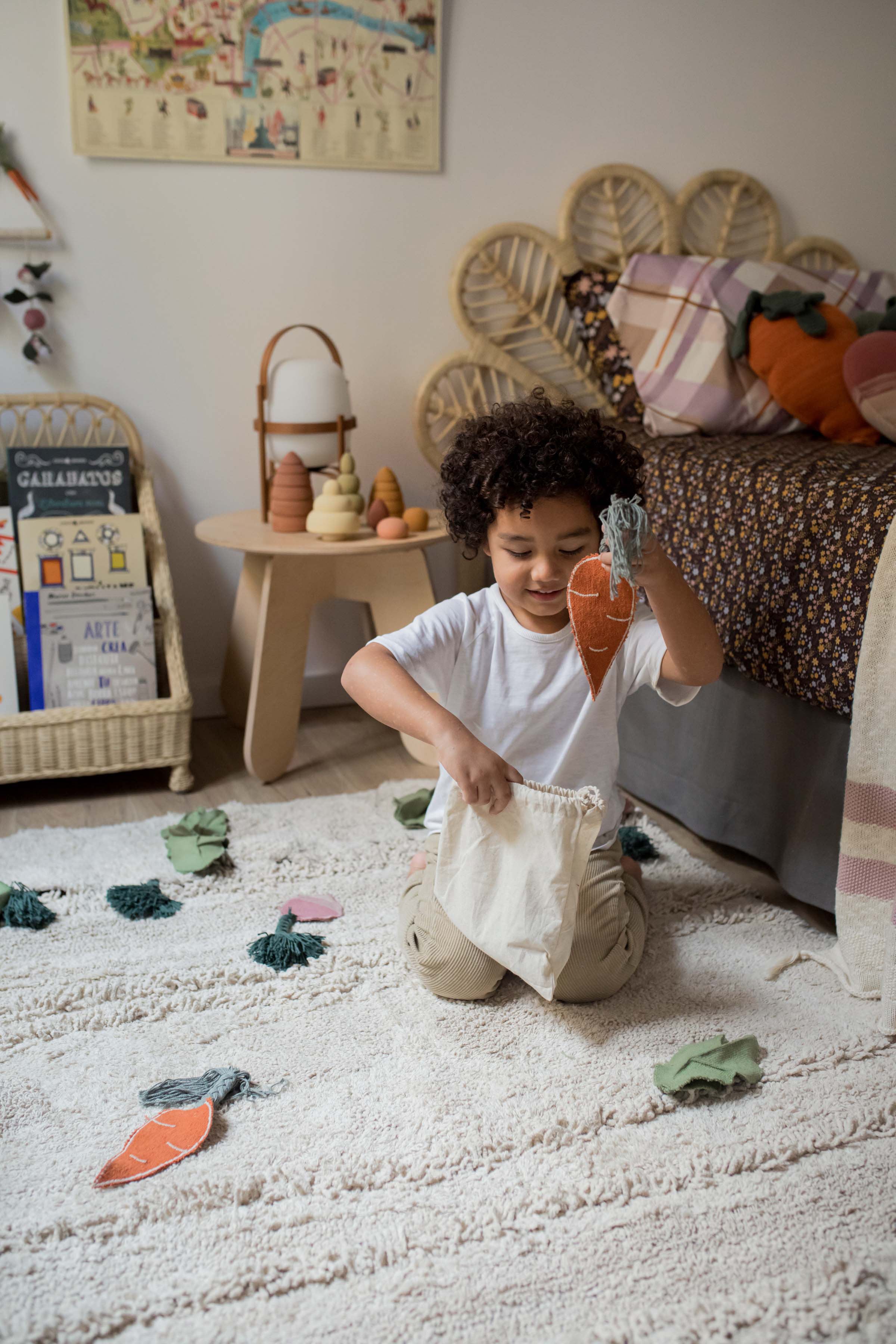 Green garden inspired rug with added vegetable toys