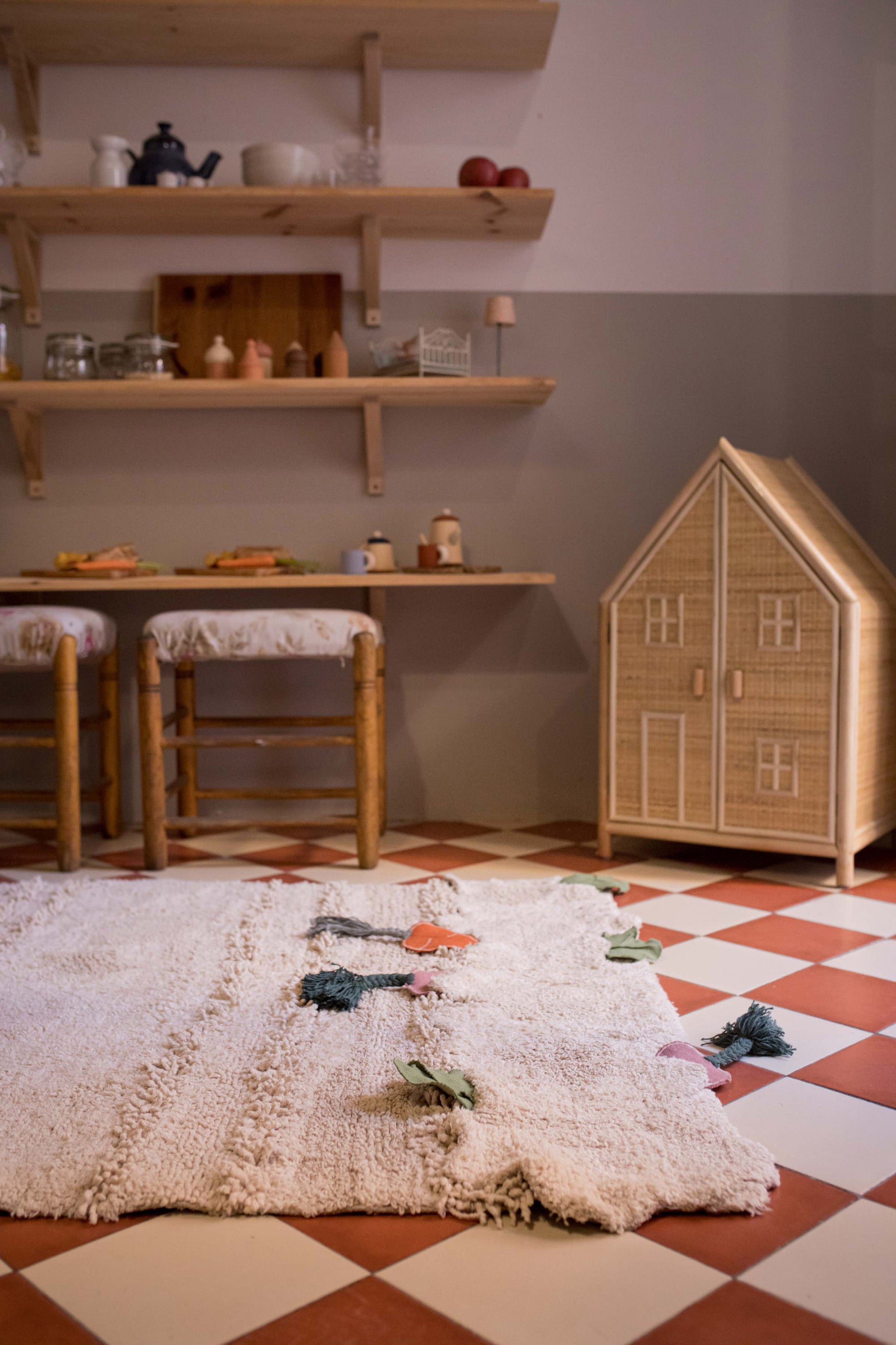 Green garden inspired rug with added vegetable toys