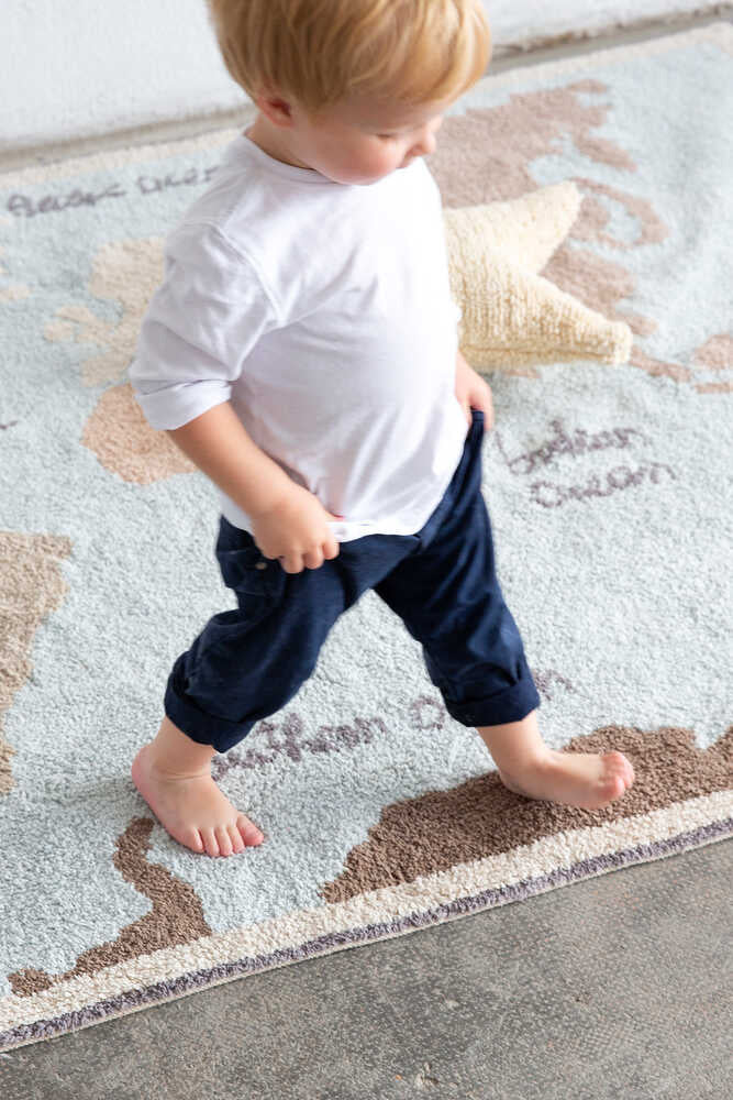 Blue children's rug with map of the world design