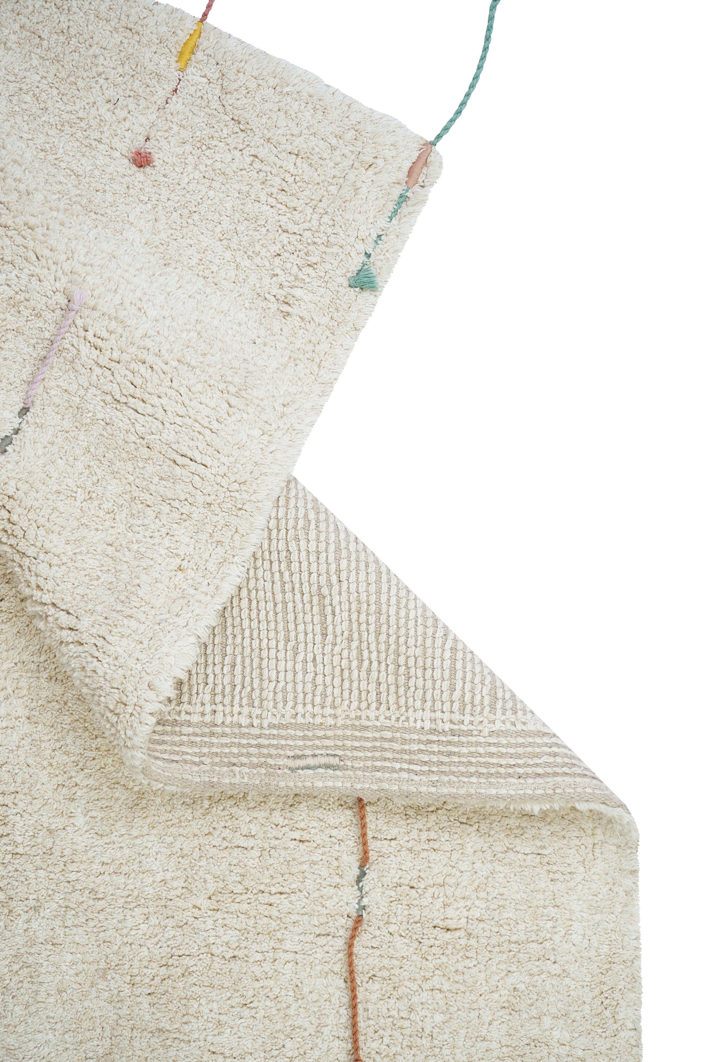 Plain cream rug with multicolour lined pattern and added wildflower toys