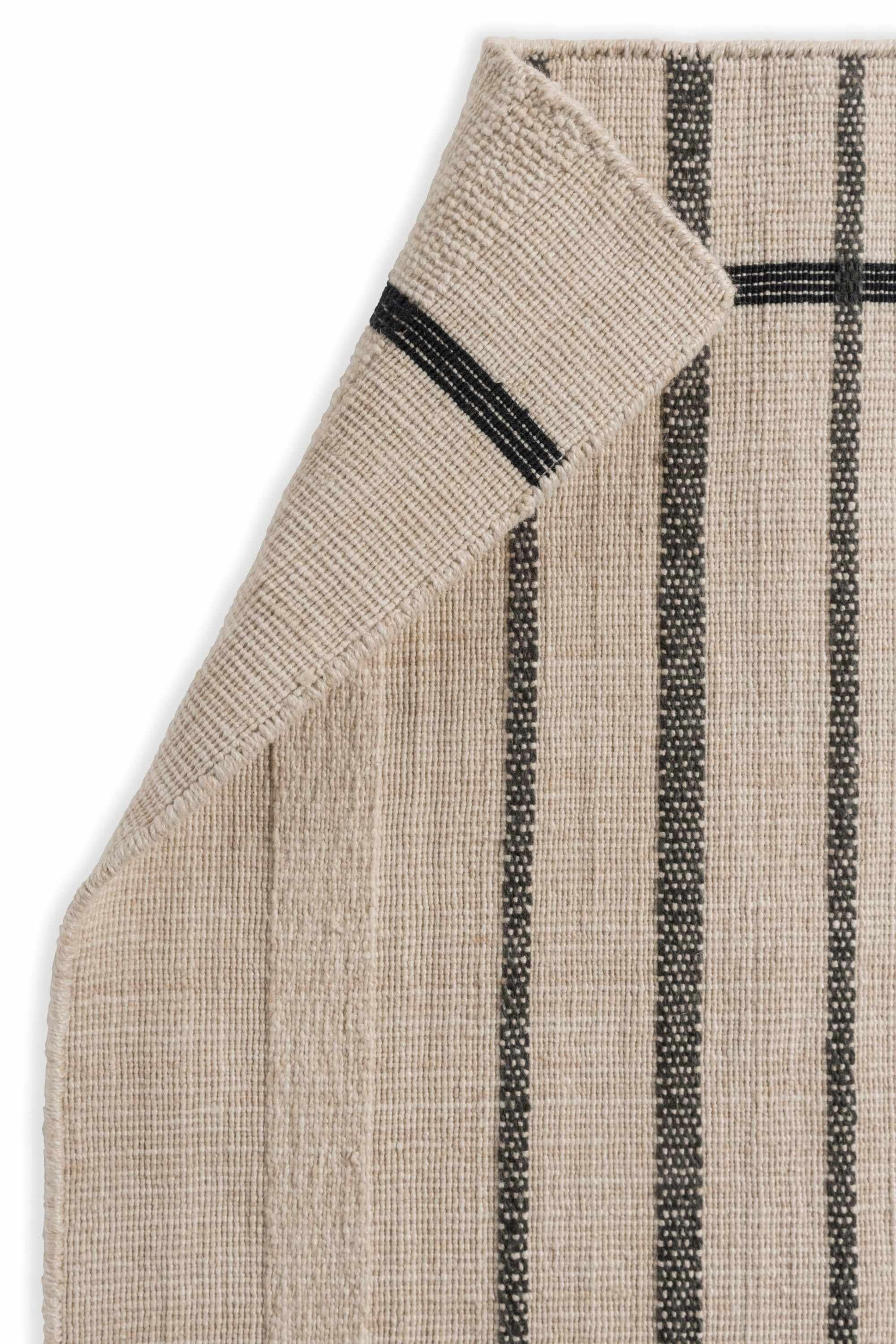 Modern beige geometric rug black pattern