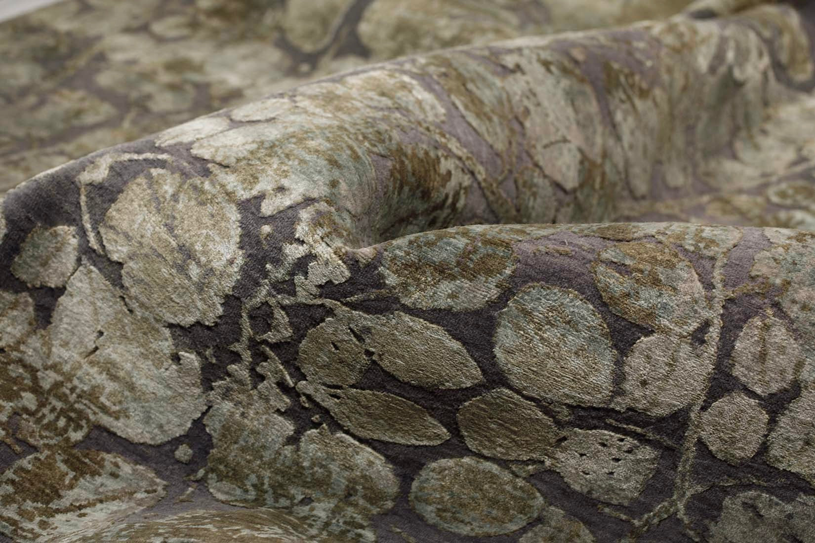 grey and taupe rug with an abstract damask pattern