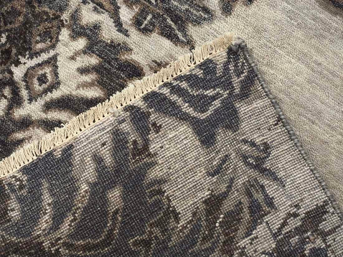 Authentic oriental rug with a damask pattern in beige and brown