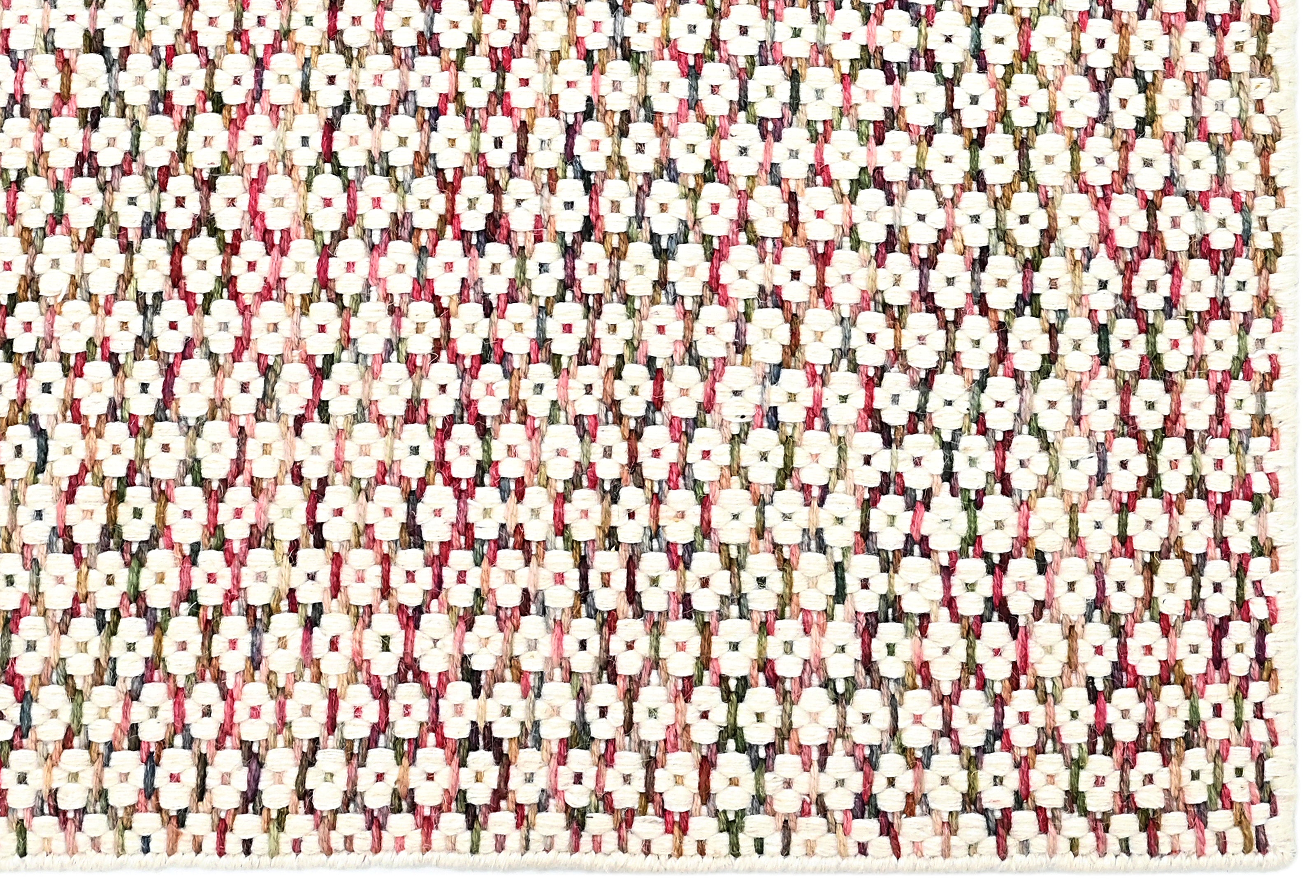 Textured wool rug with pink, blue and green yarns throughout