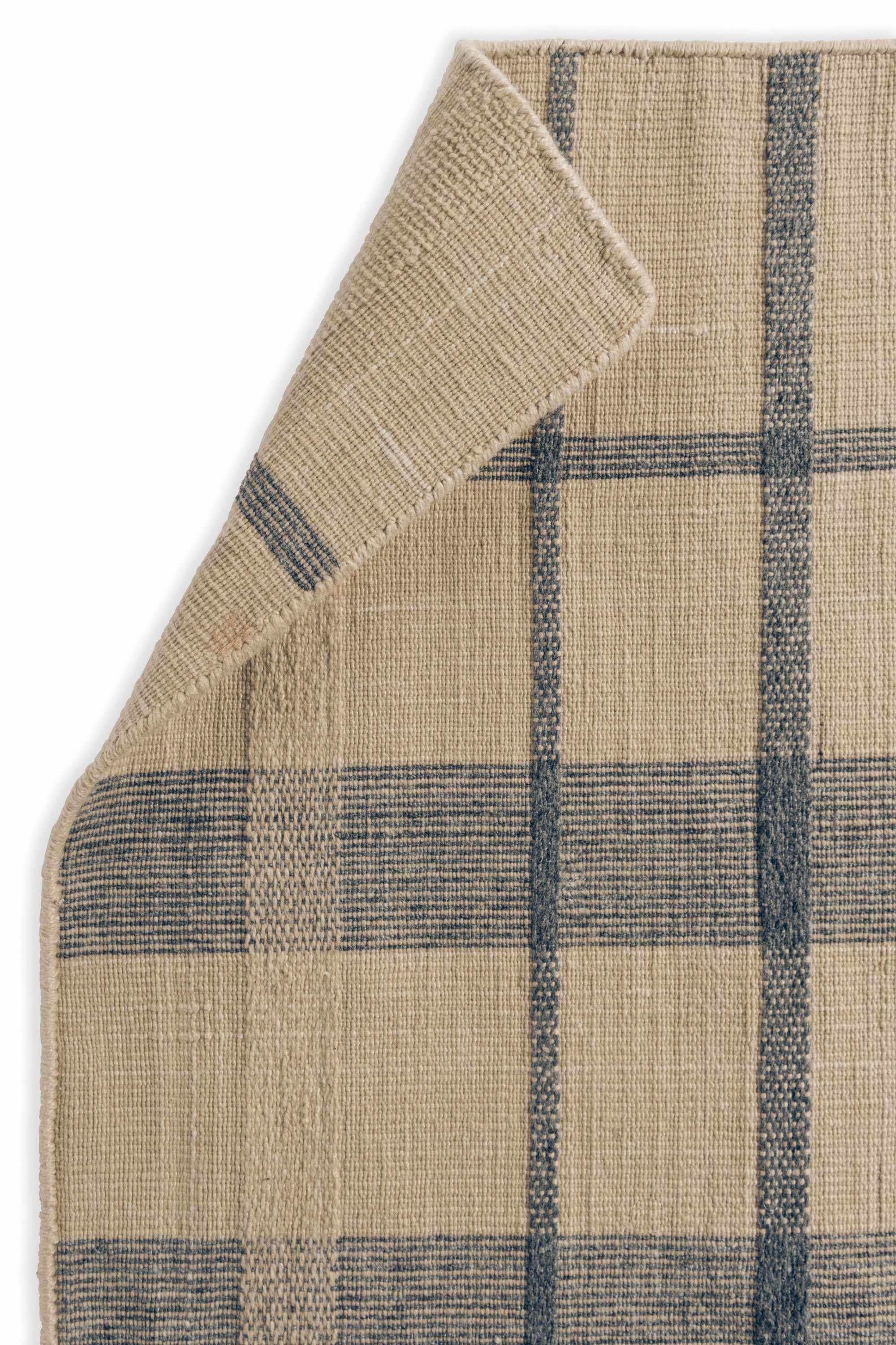 Modern beige geometric rug with blue pattern