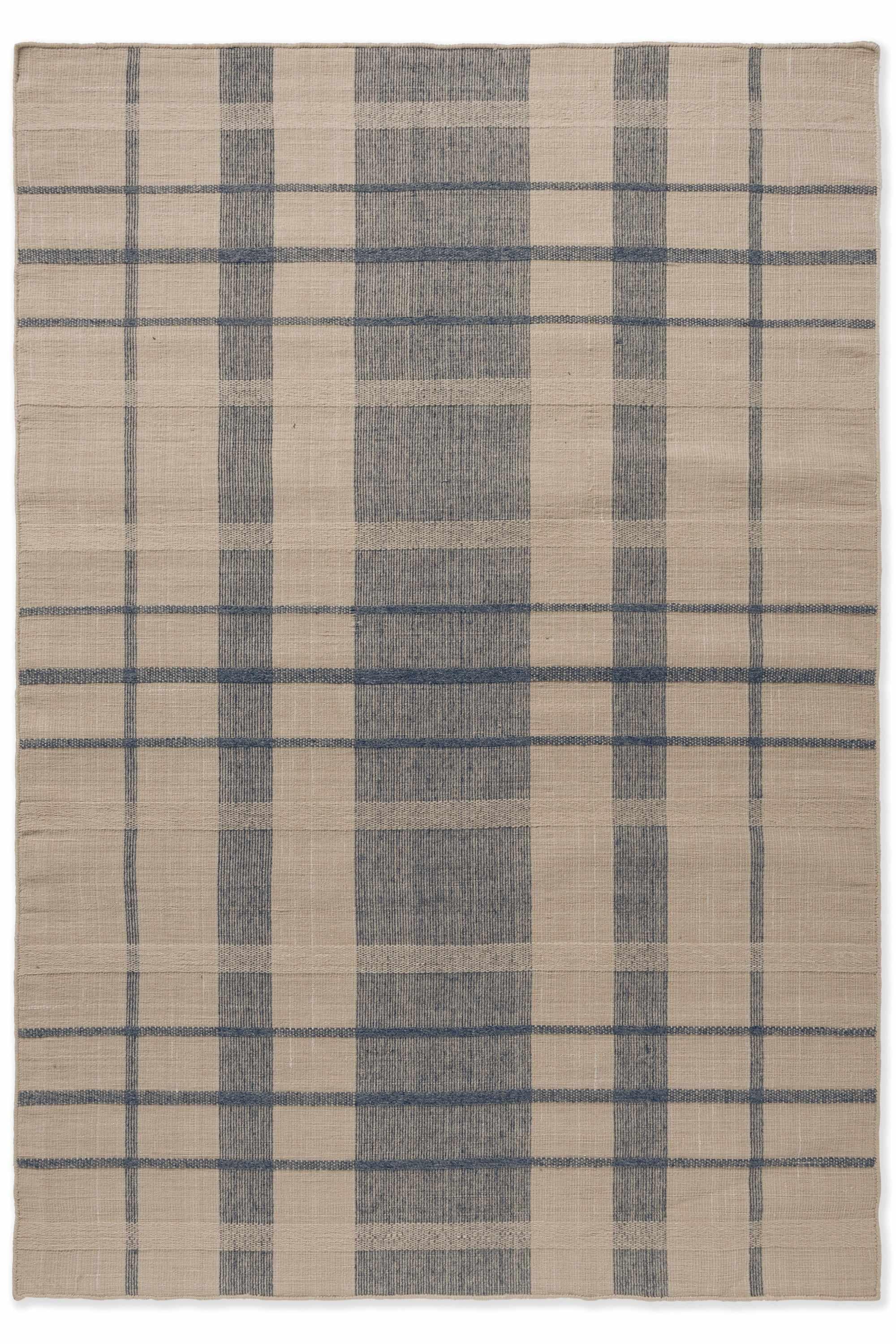 Modern beige geometric rug with blue pattern