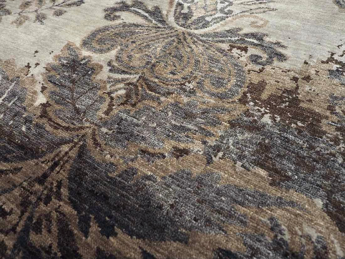 Authentic oriental rug with a damask pattern in beige and brown
