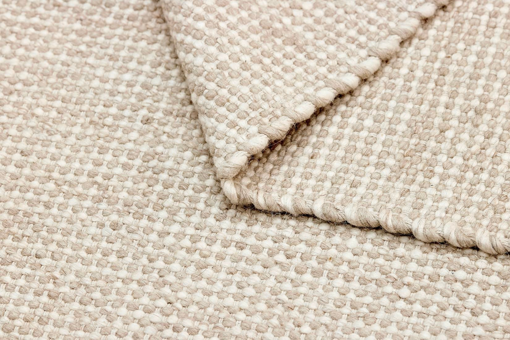 Simple beige textured area rug