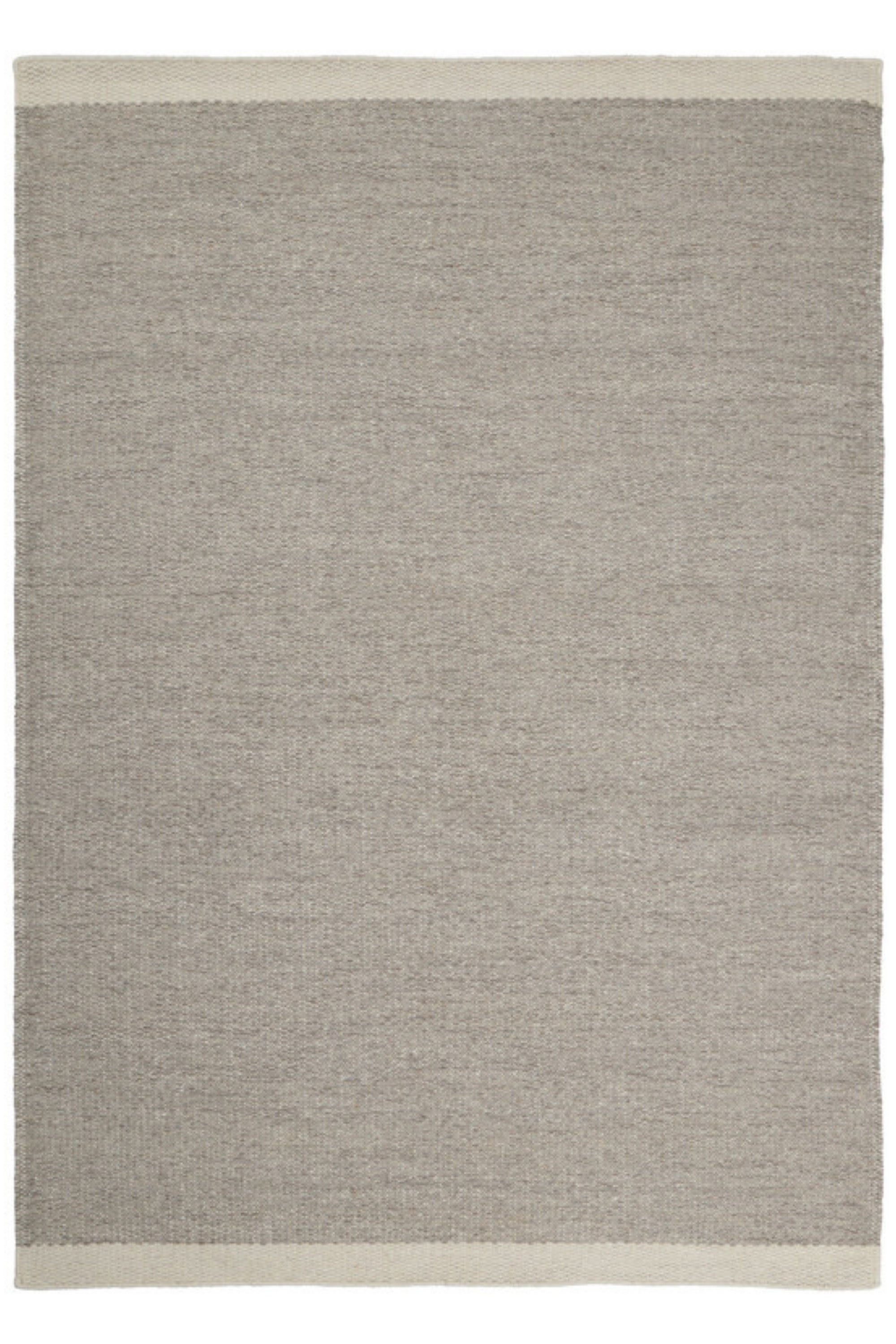 Woven beige wool rug