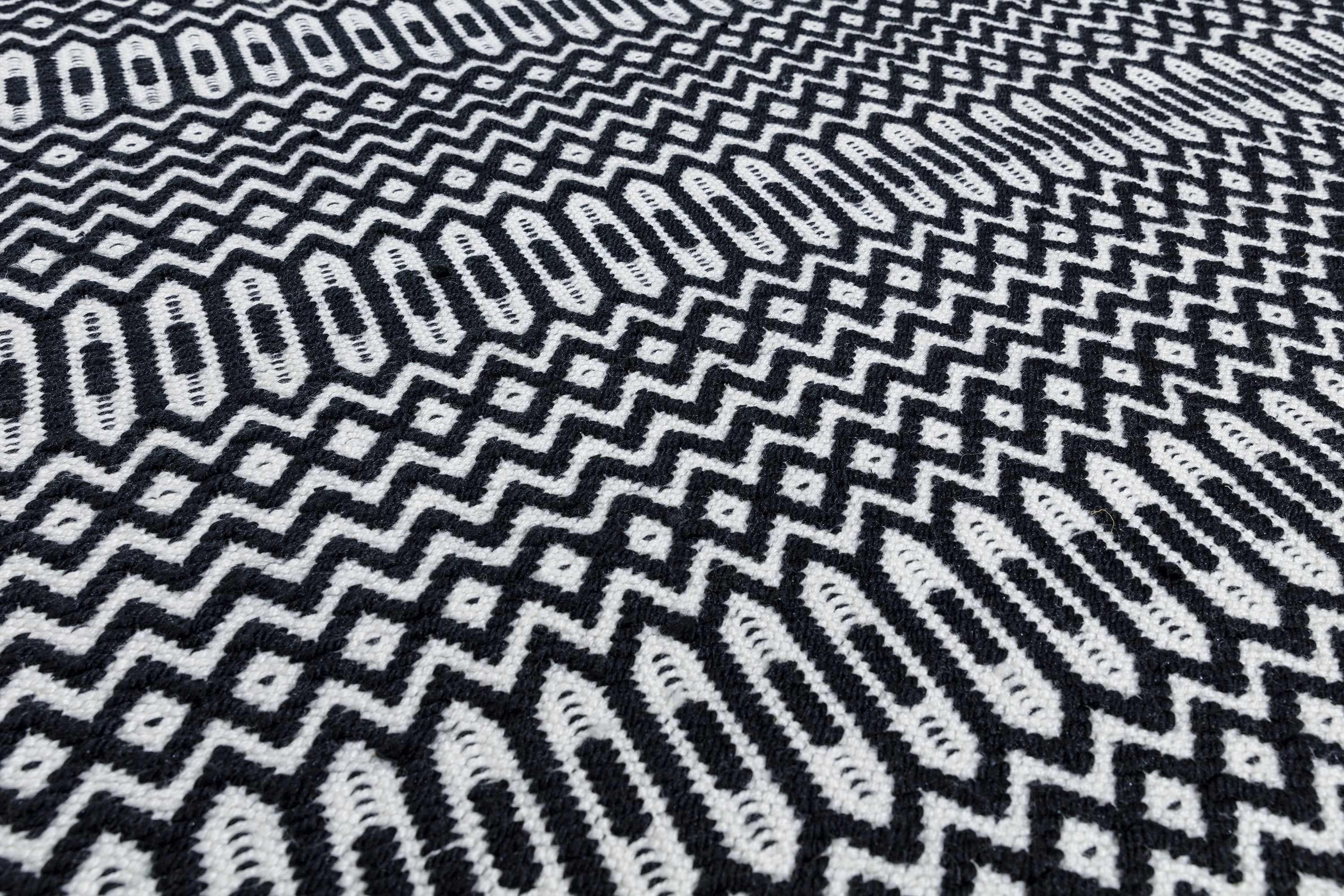 black indoor/outdoor runner with geometric design