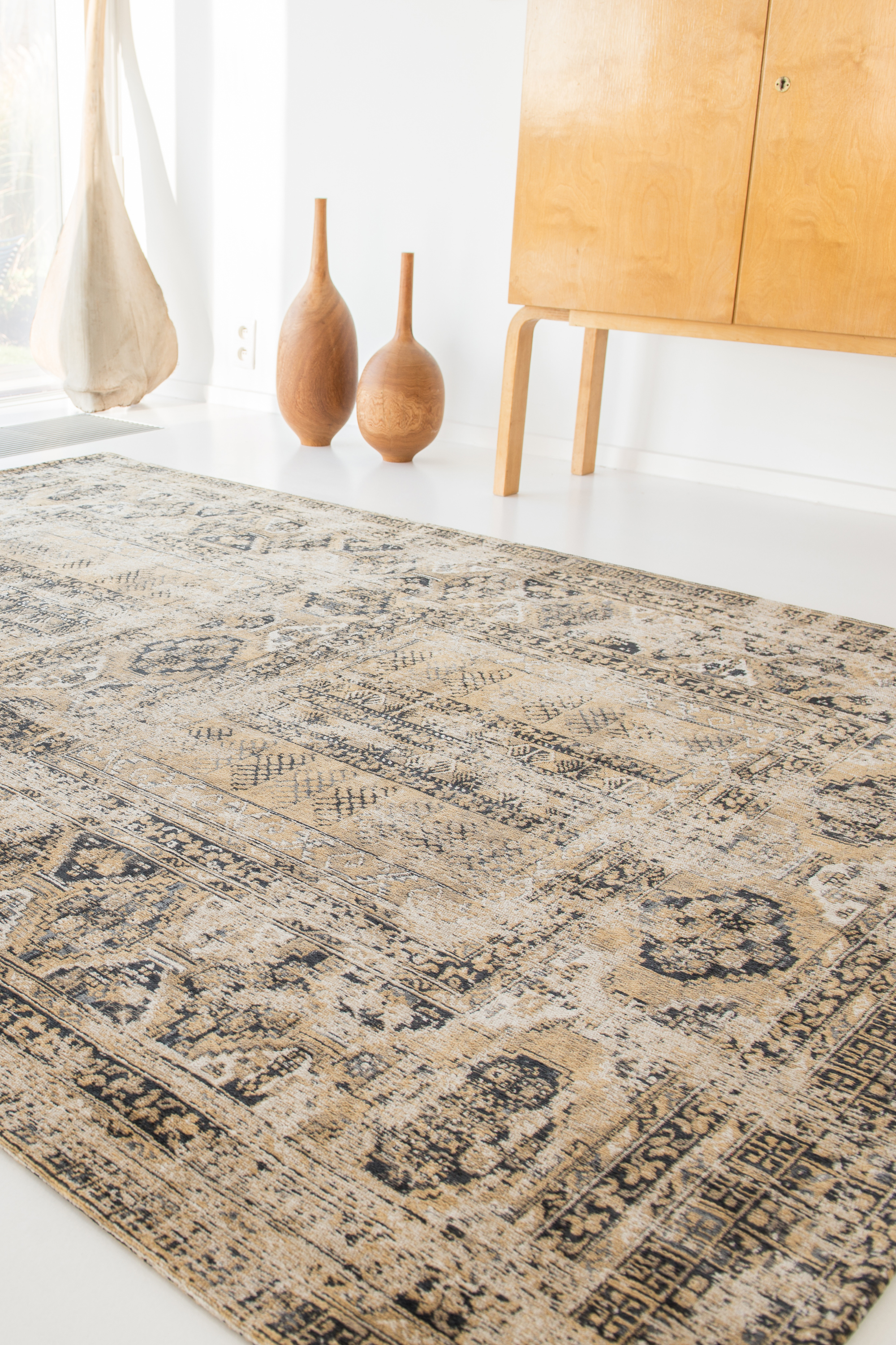 Gold and beige flatweave rug with faded persian design of floral motifs and gul medallions