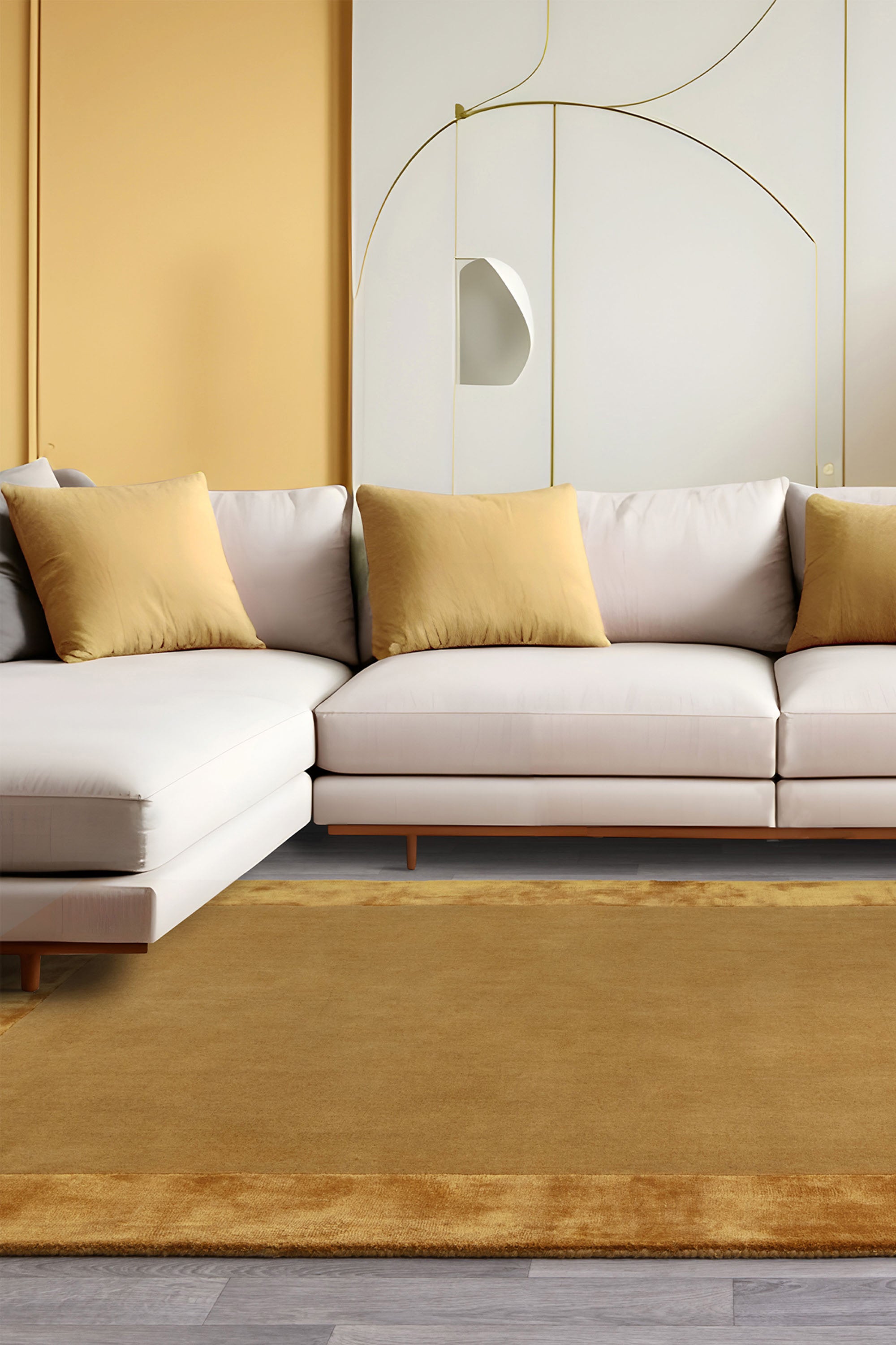 Gold wool and viscose rug with a border design