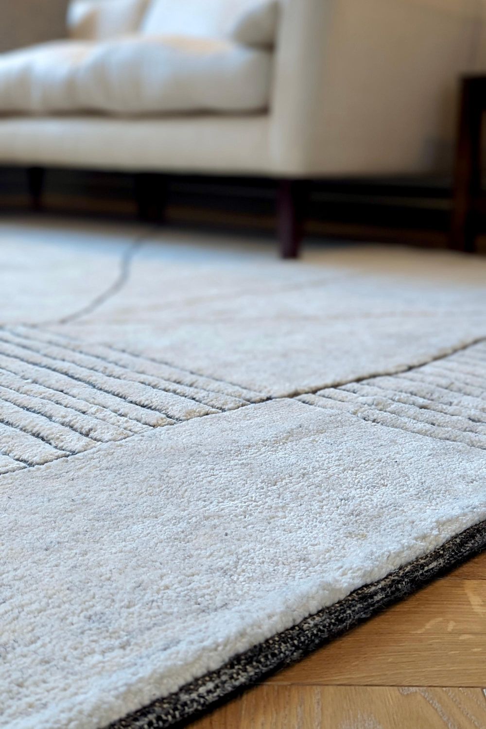 Cream area rug with abstract design