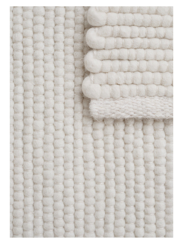 White textured woven rug