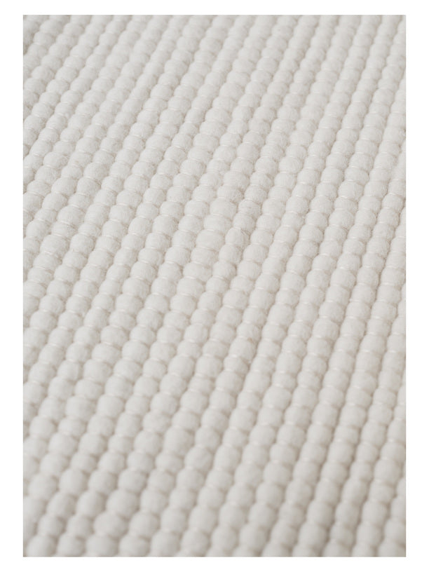 White textured woven rug