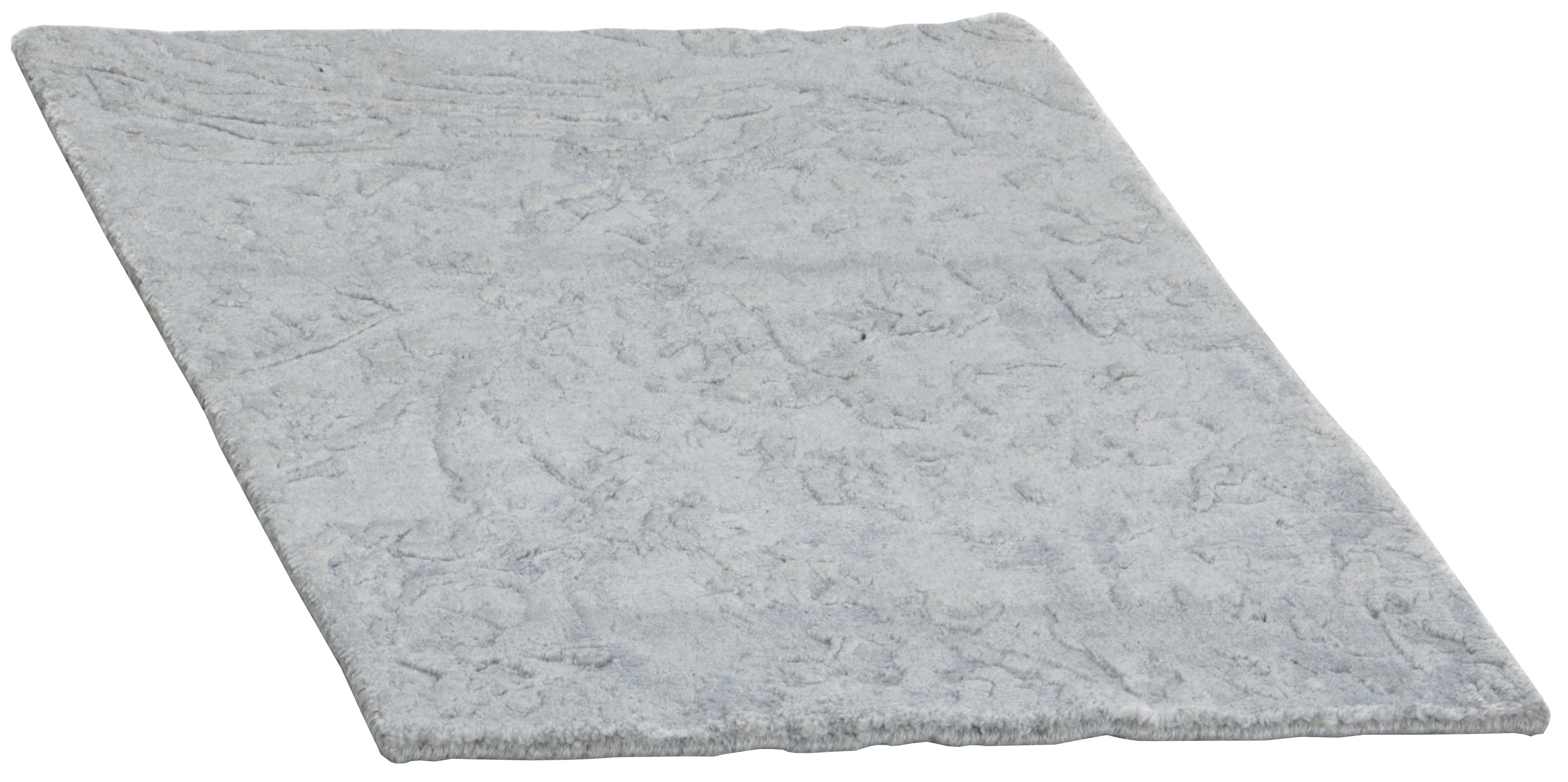 Area rug with abstract design in grey and beige