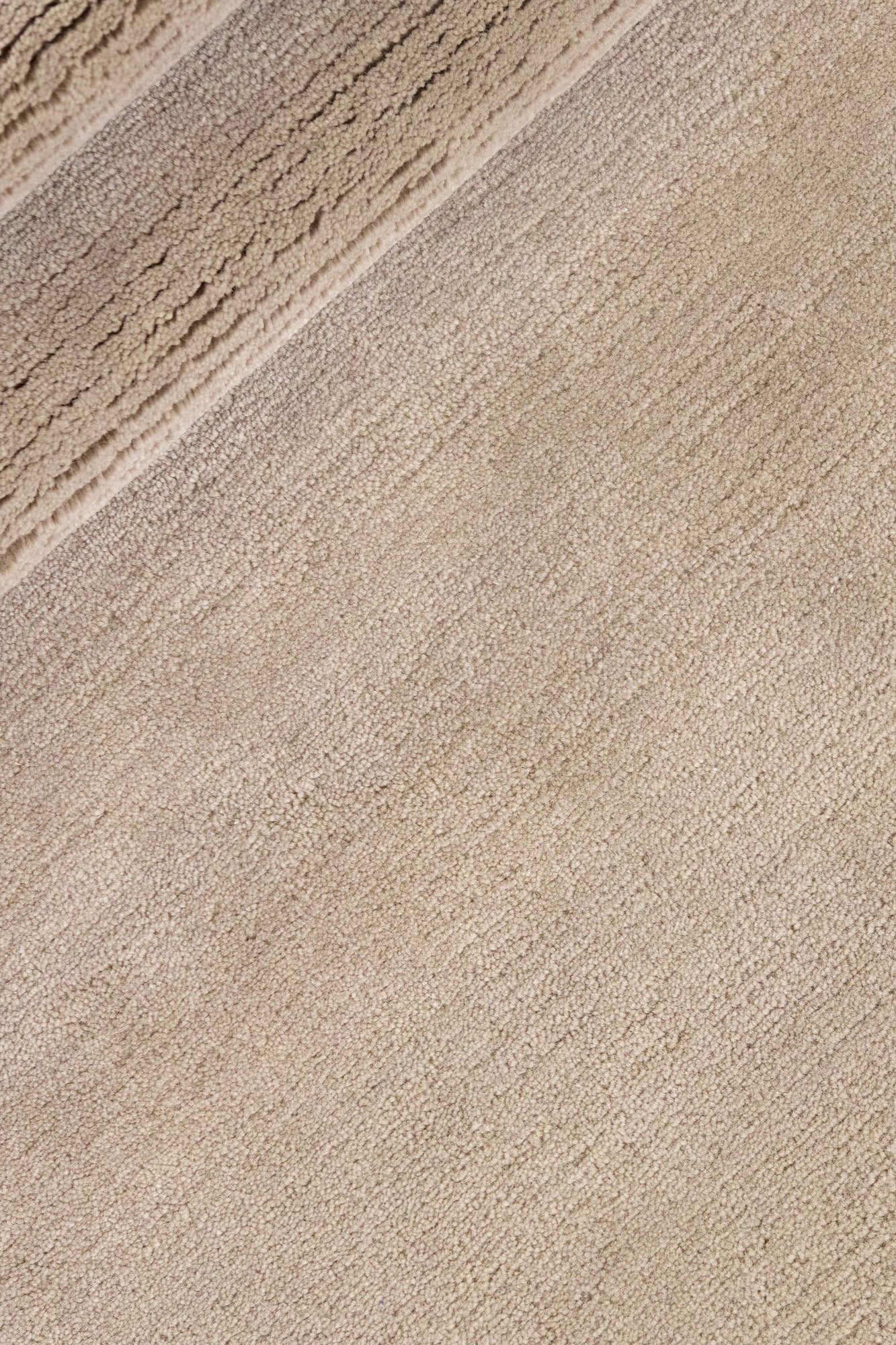 Luxury plain modern round beige rug