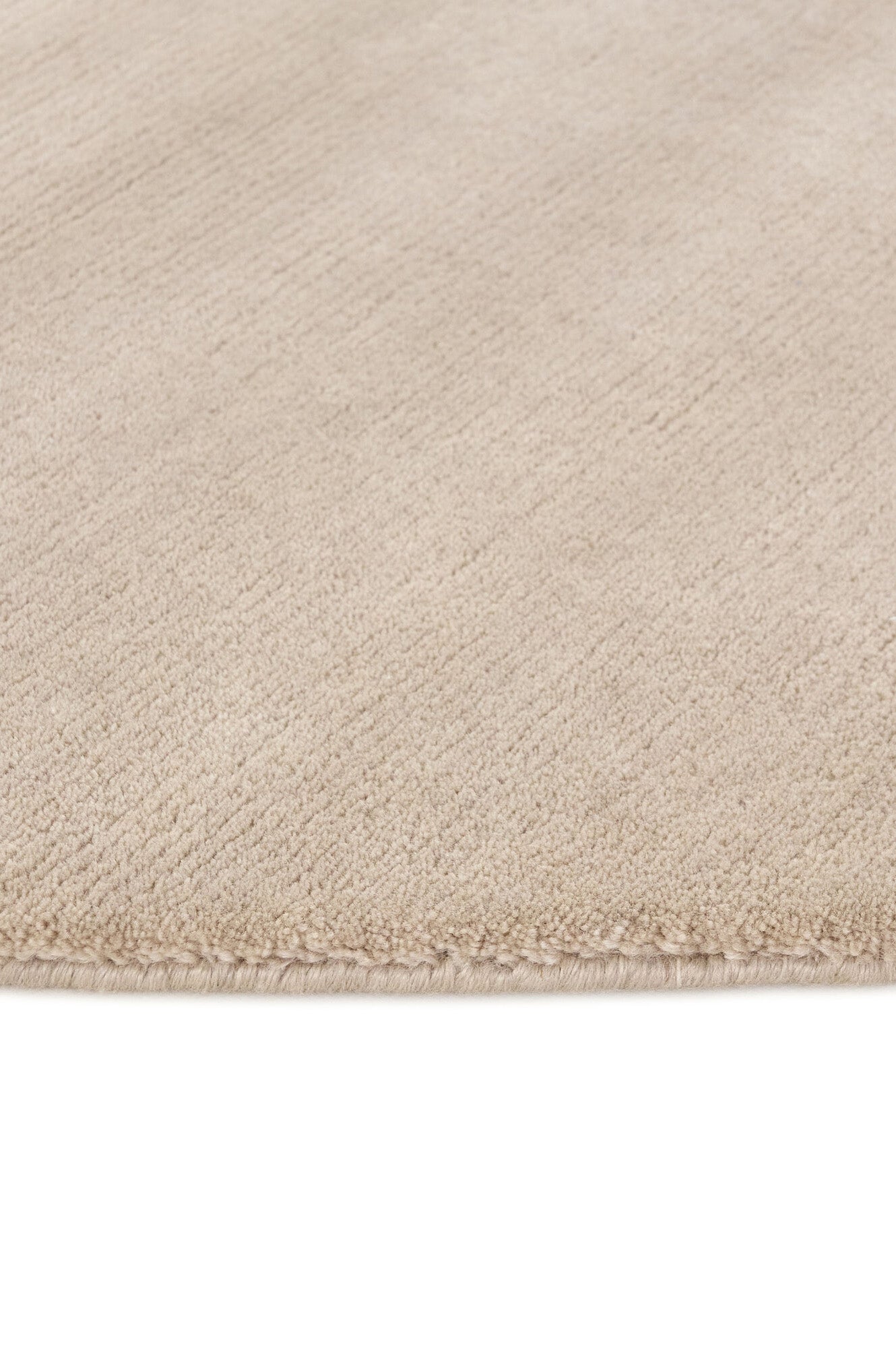 Luxury plain modern round beige rug