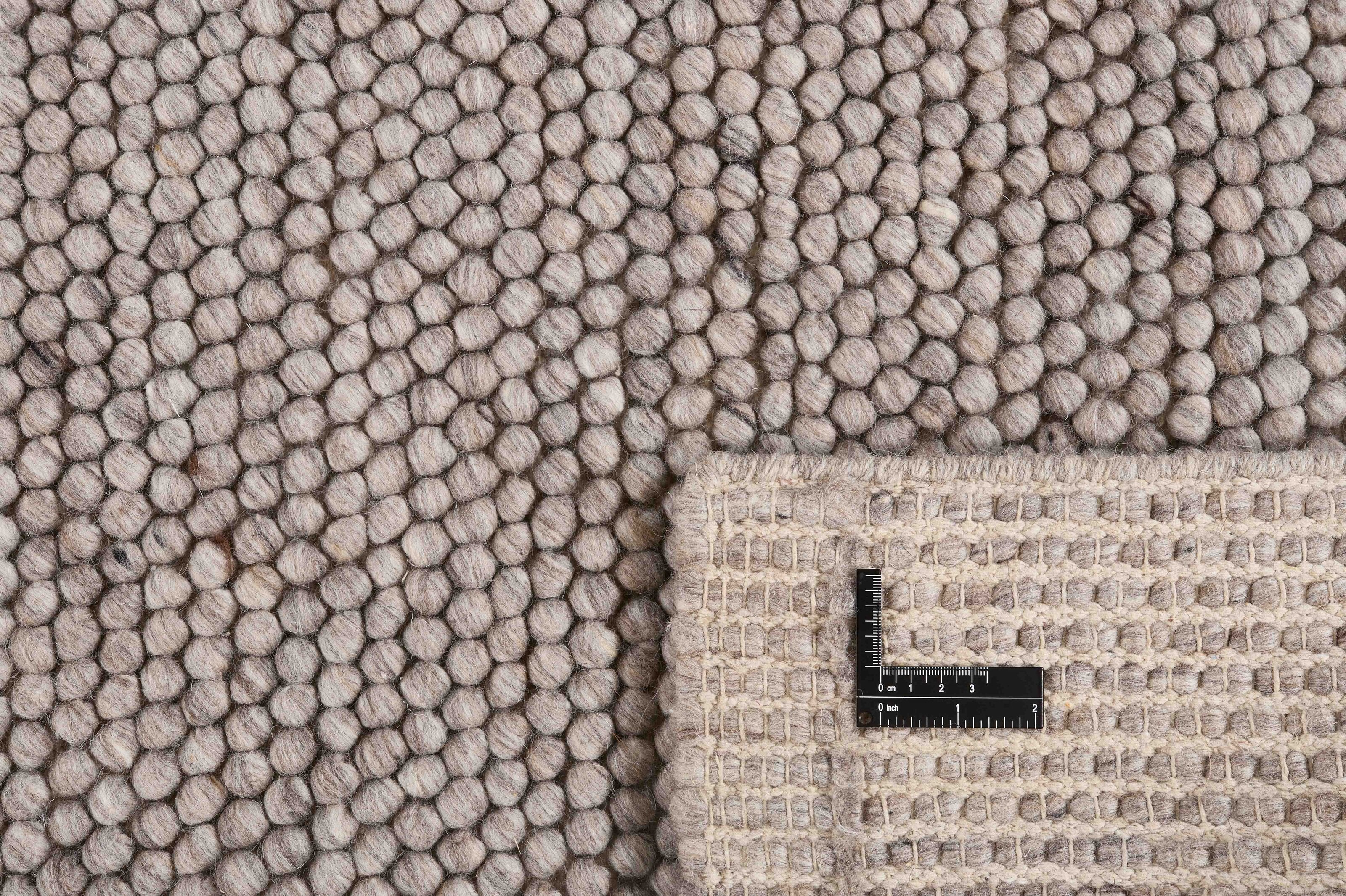 Beige textured wool rug