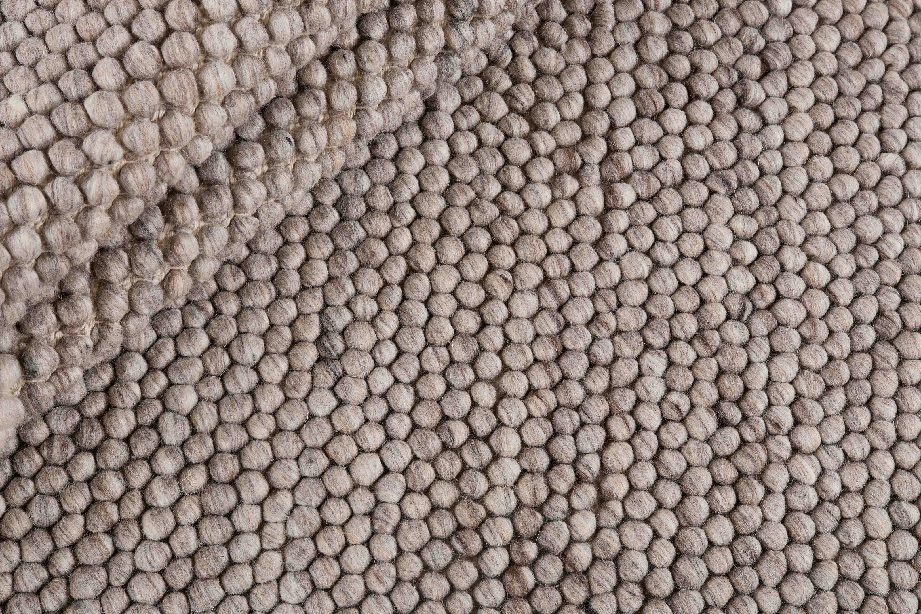 Beige textured wool rug