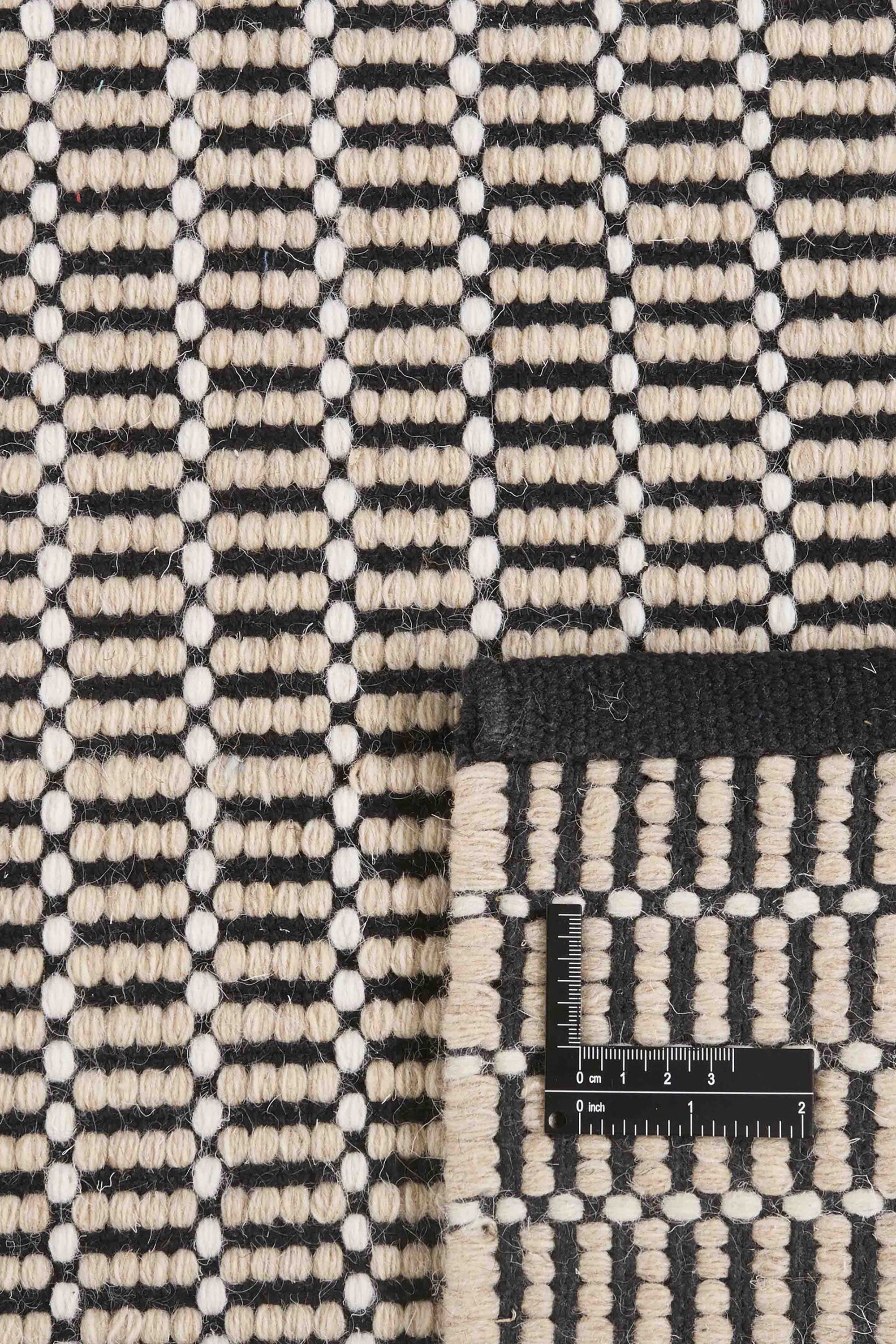 Luxury cream and black woven rug