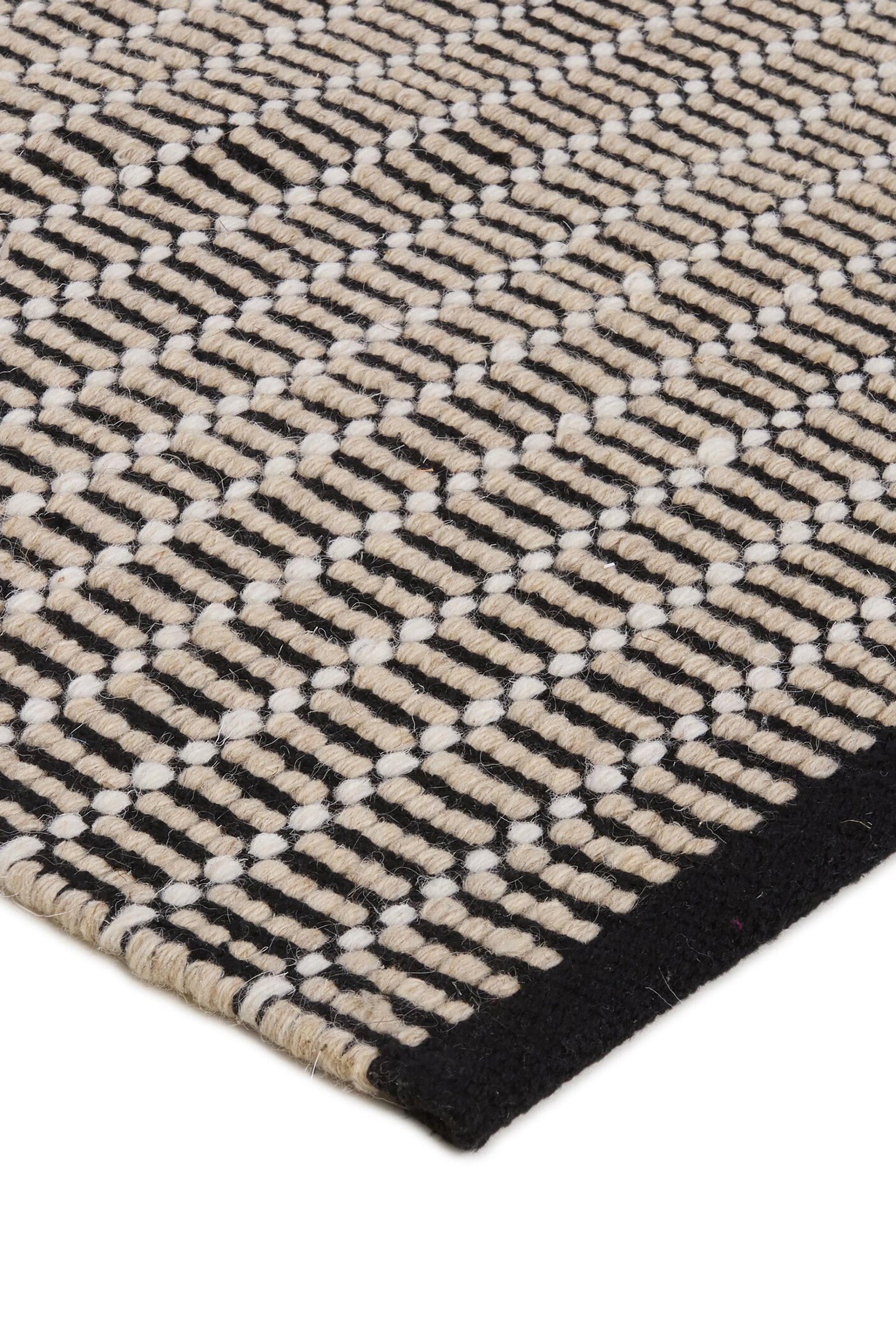 Luxury cream and black woven rug