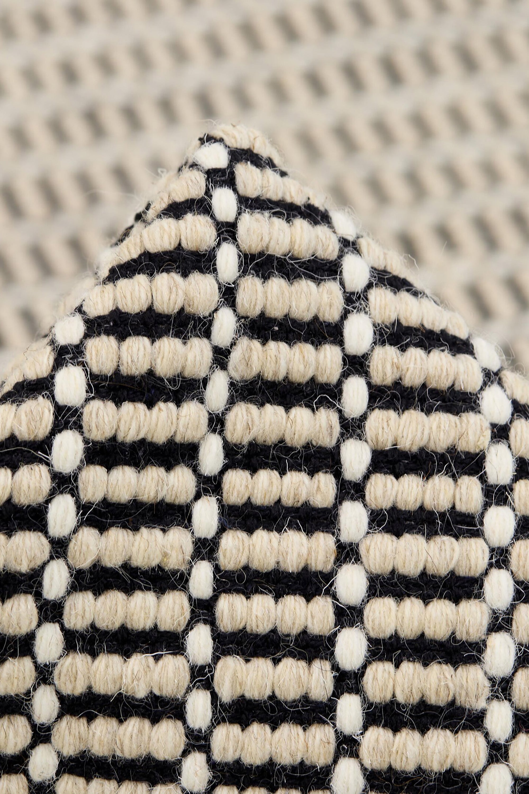 Luxury cream and black woven rug