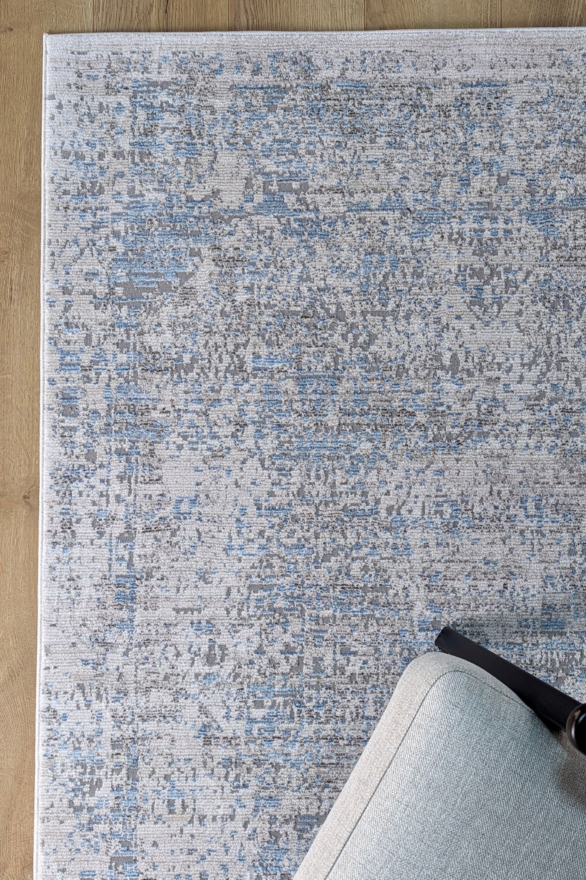 Persian style area rug in blue and grey
