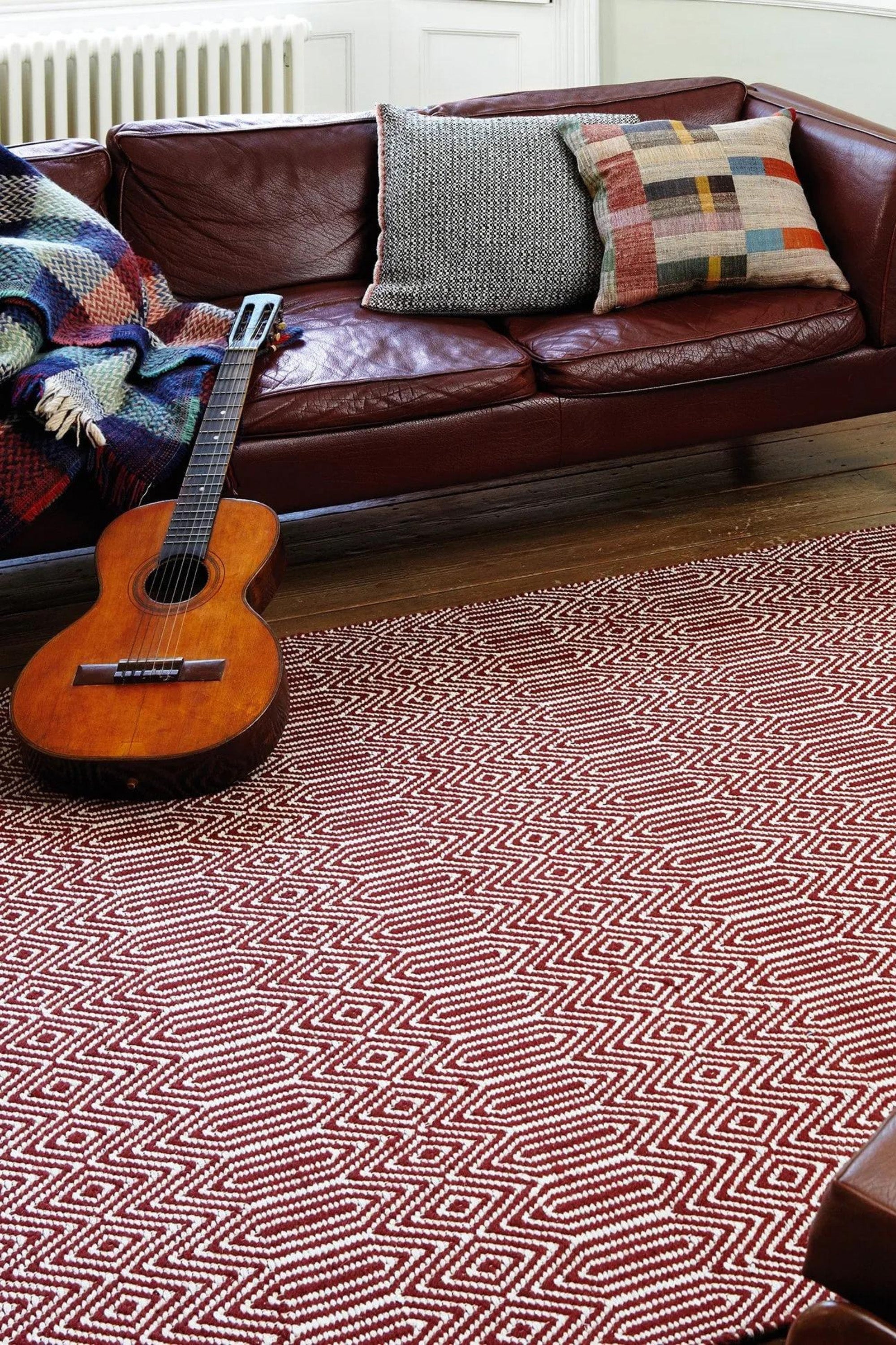 red and white woven rug with aztec chevron pattern