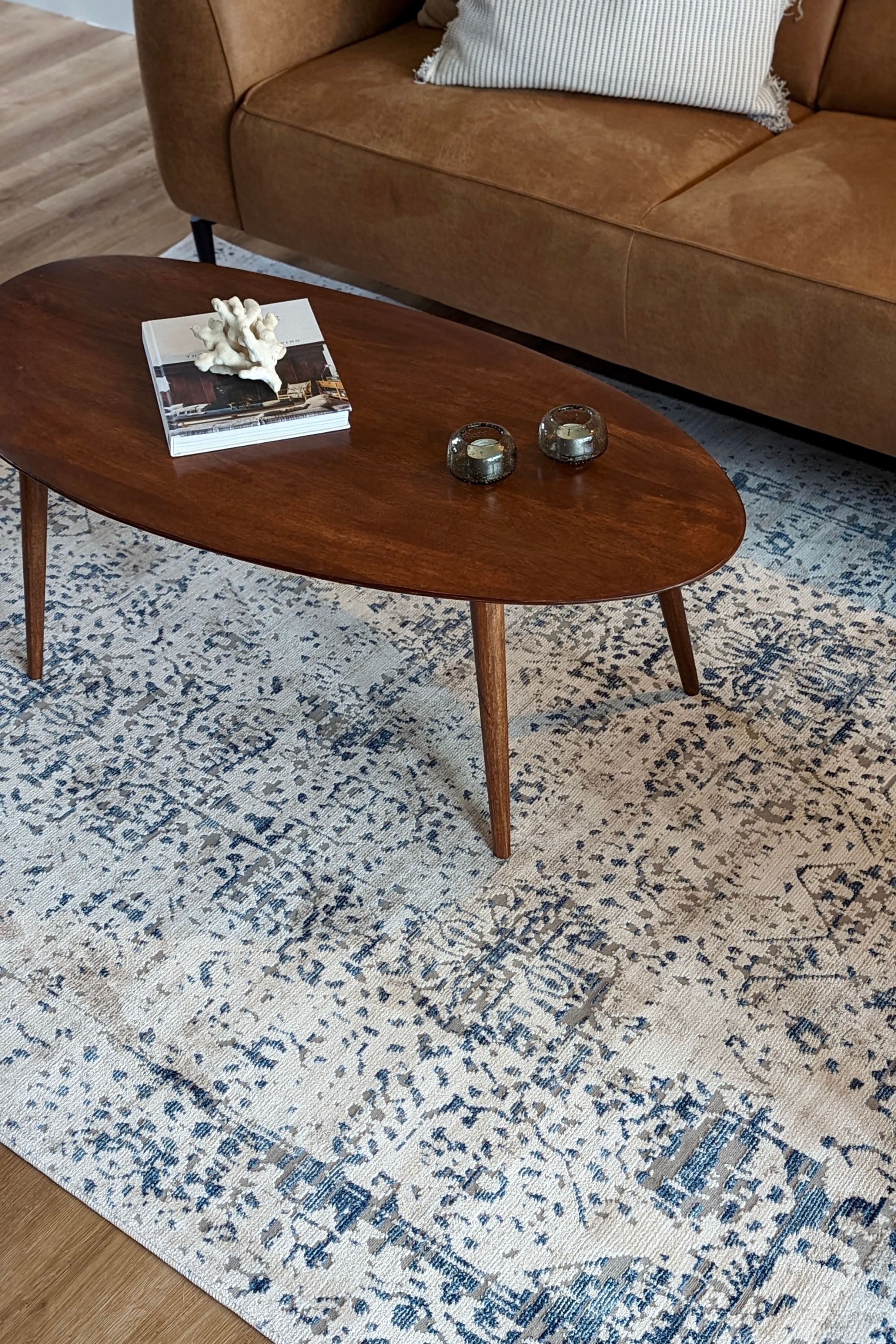 grey Persian style area rug with navy detail