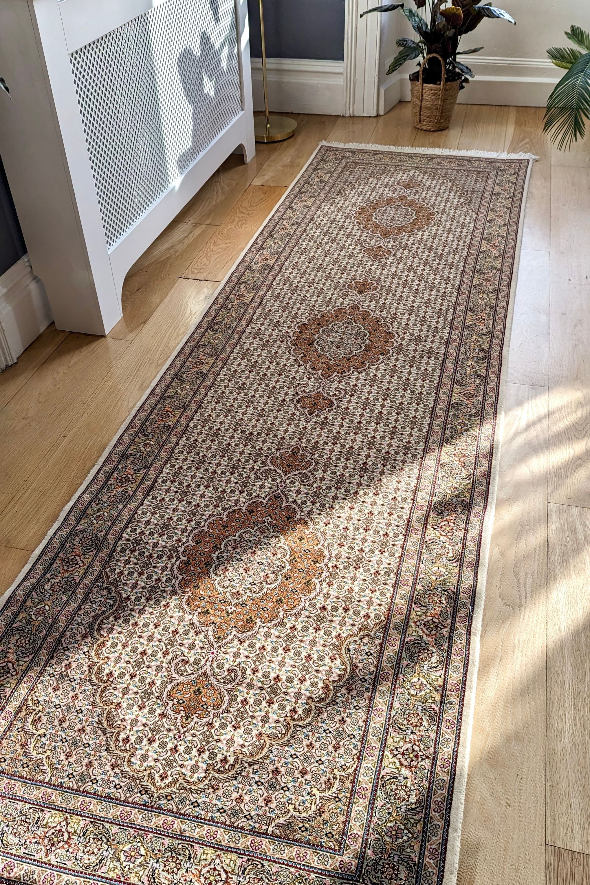 Authentic persian runner with traditional floral design in red