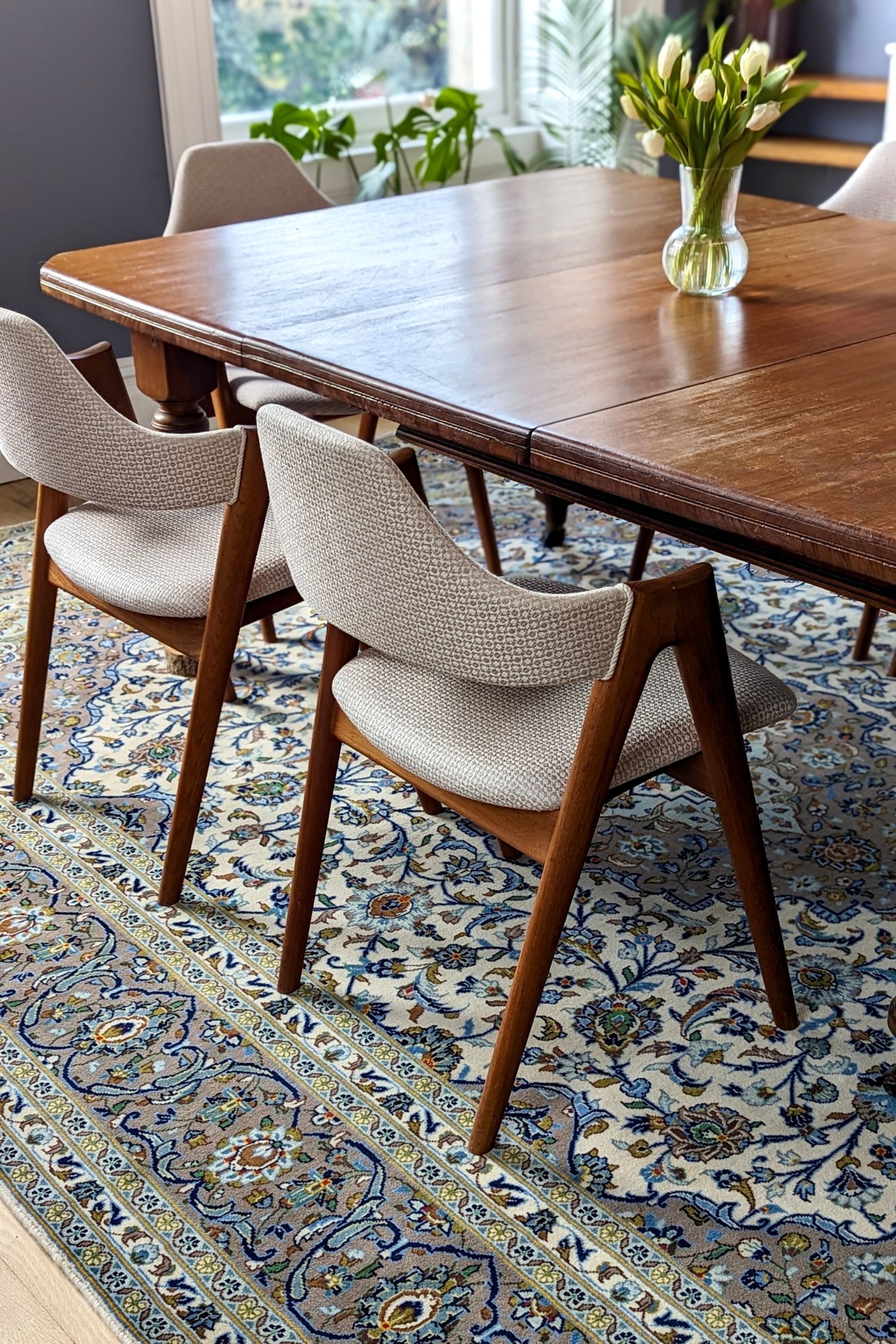Authentic persian rug with traditional floral design in beige and blue