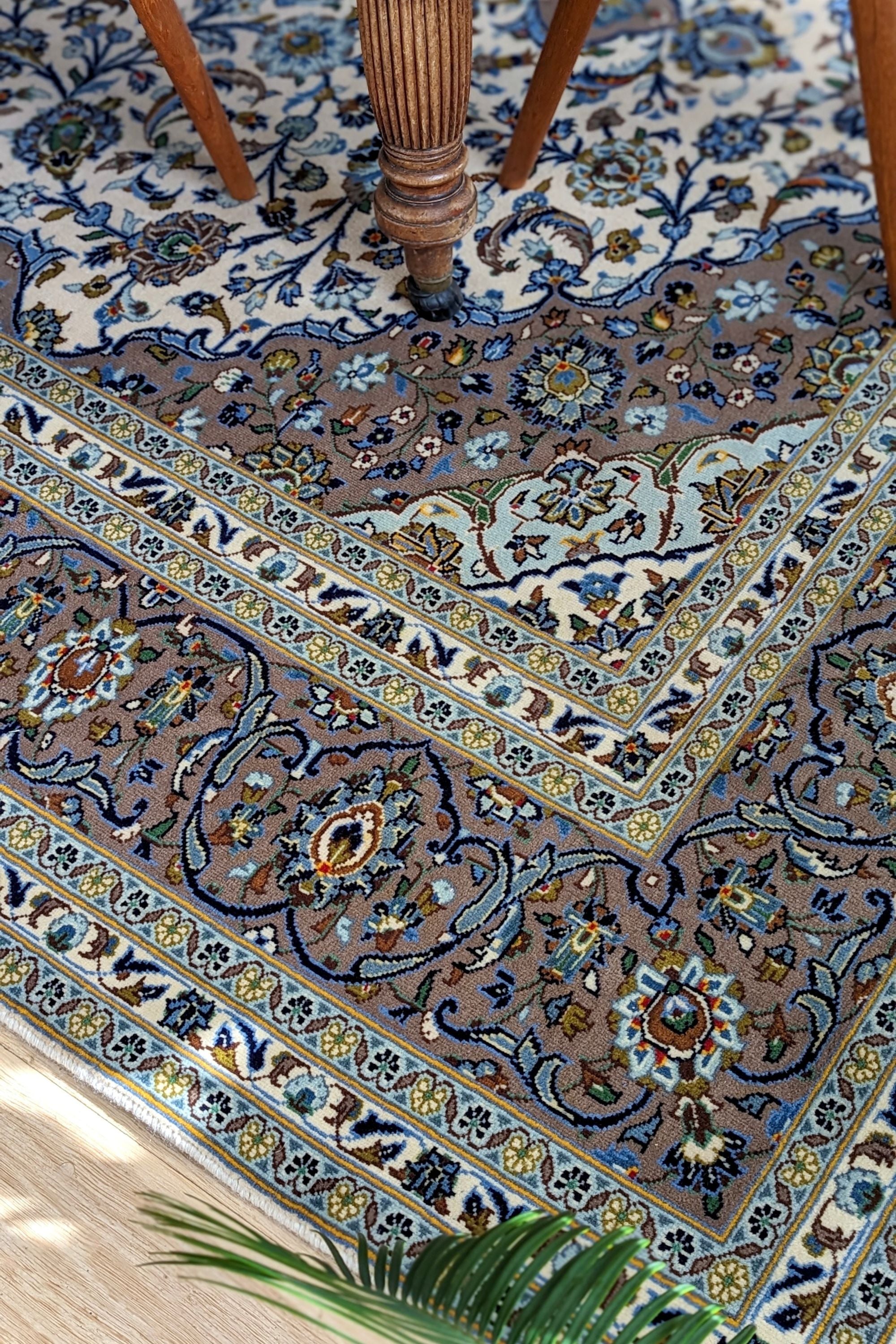 Authentic persian rug with traditional floral design in beige and blue