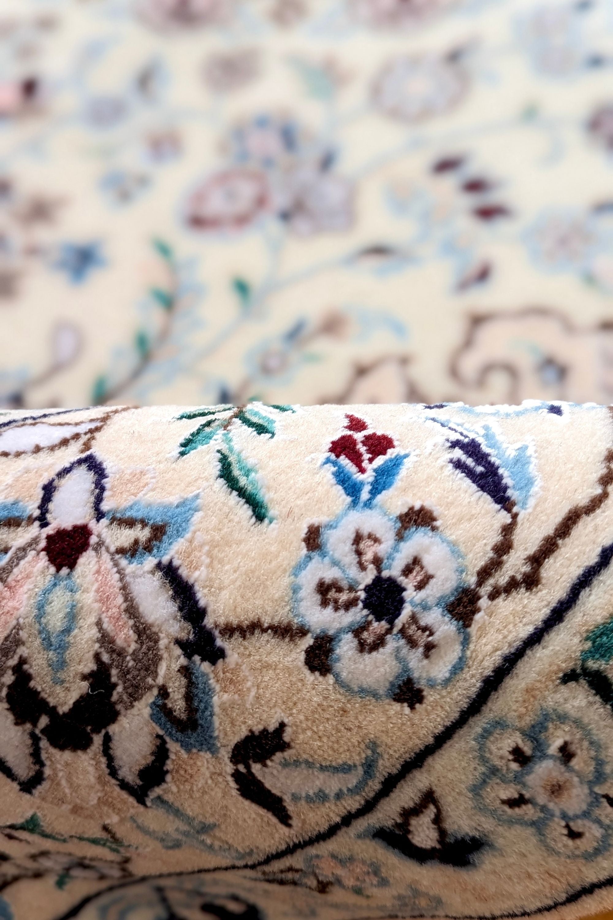Cream Nain Persian rug with blue and red floral pattern