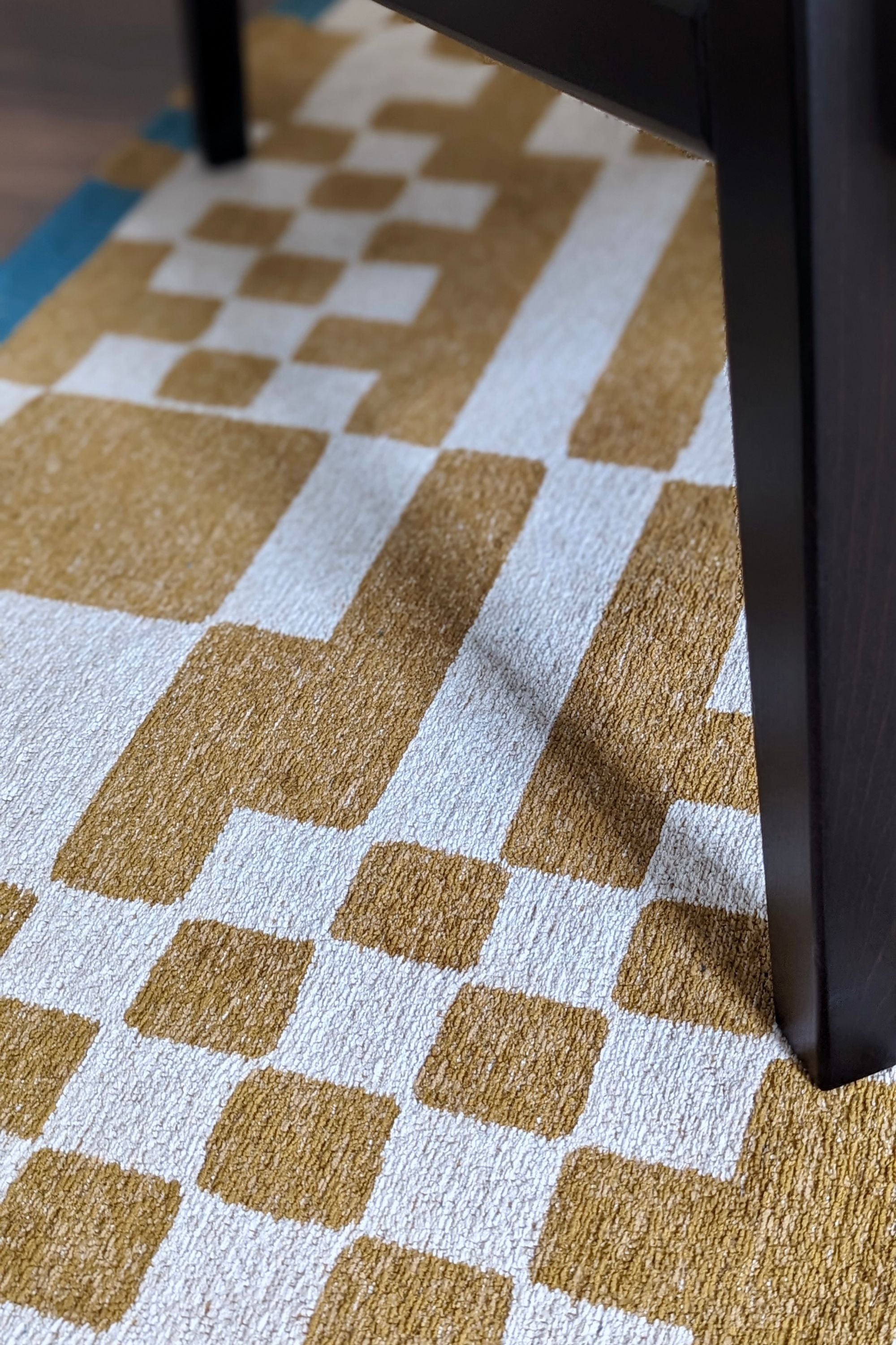 Abstract geometric rug with yellow, green, and white tones