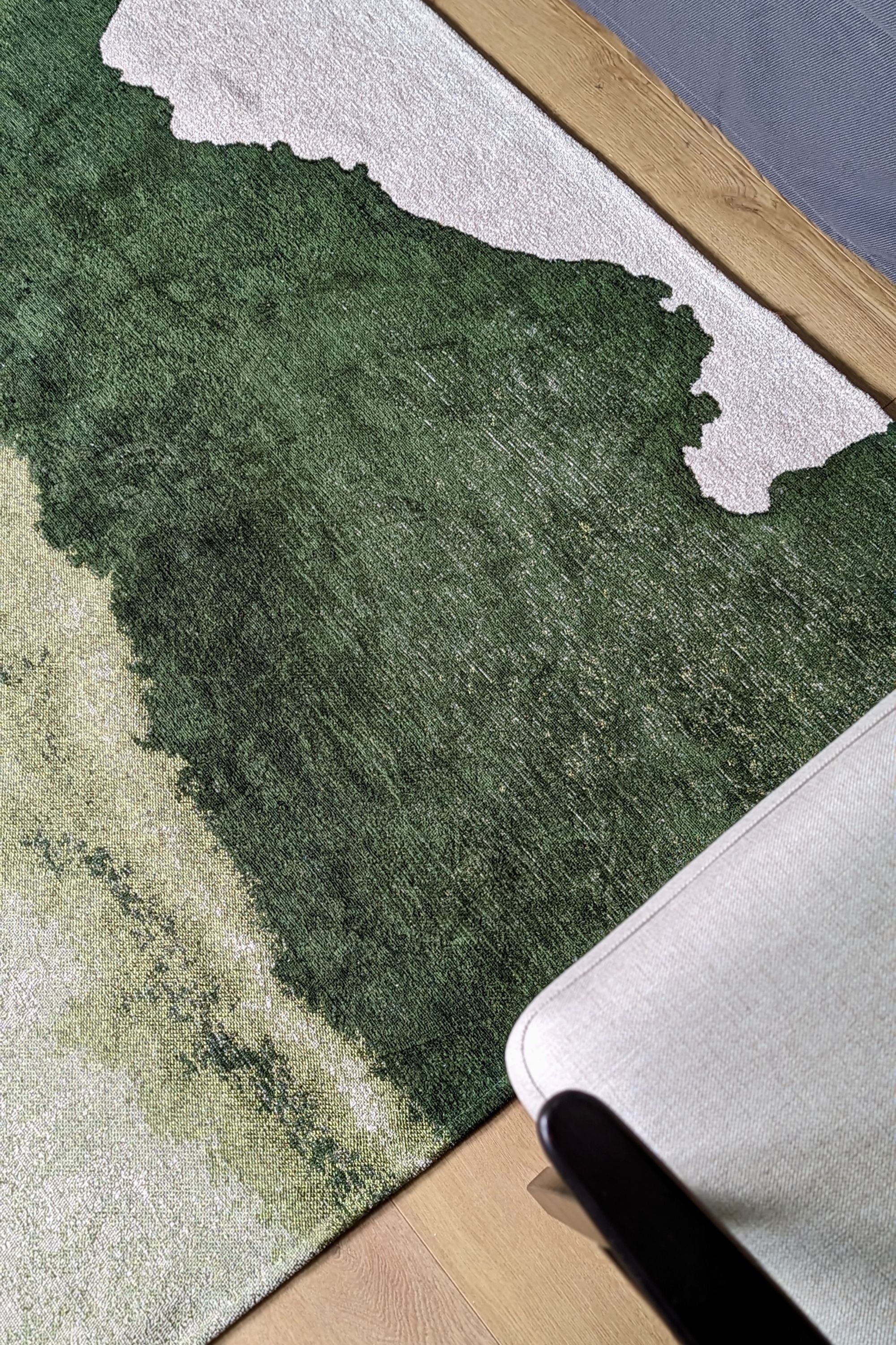 Modern rug with green abstract shoreline pattern