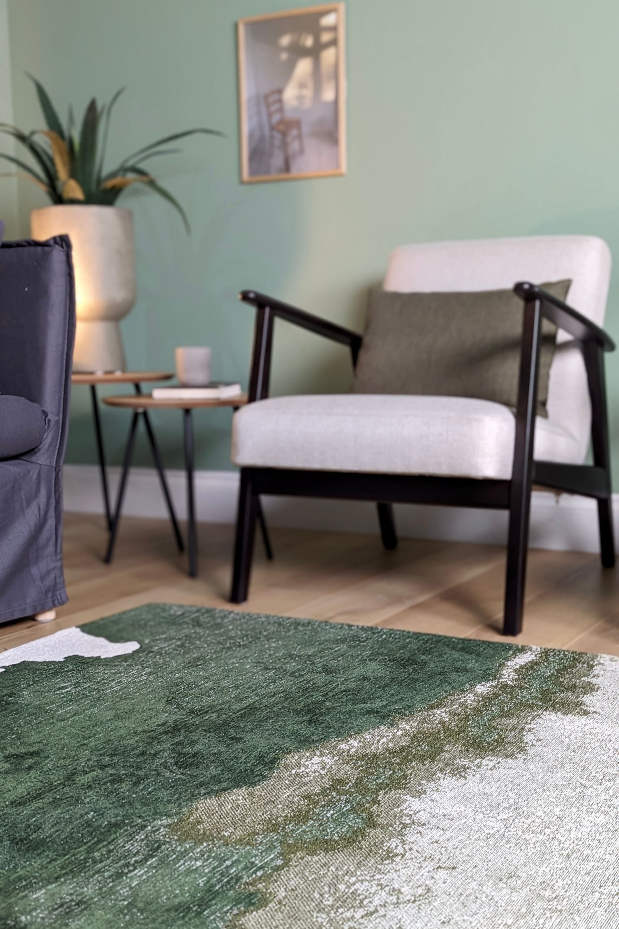 Modern rug with green abstract shoreline pattern