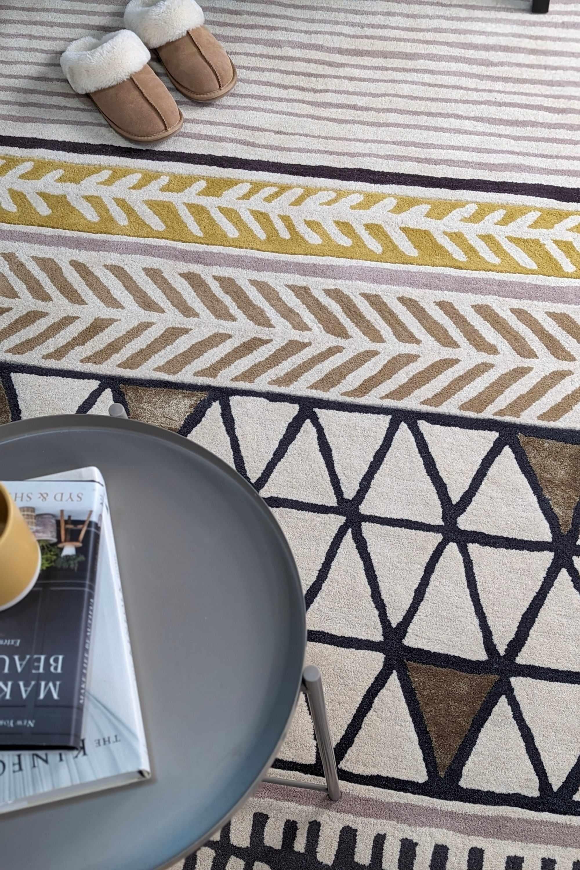 Quirky ethnic inspired pattern in yellow, taupe, cream and grey