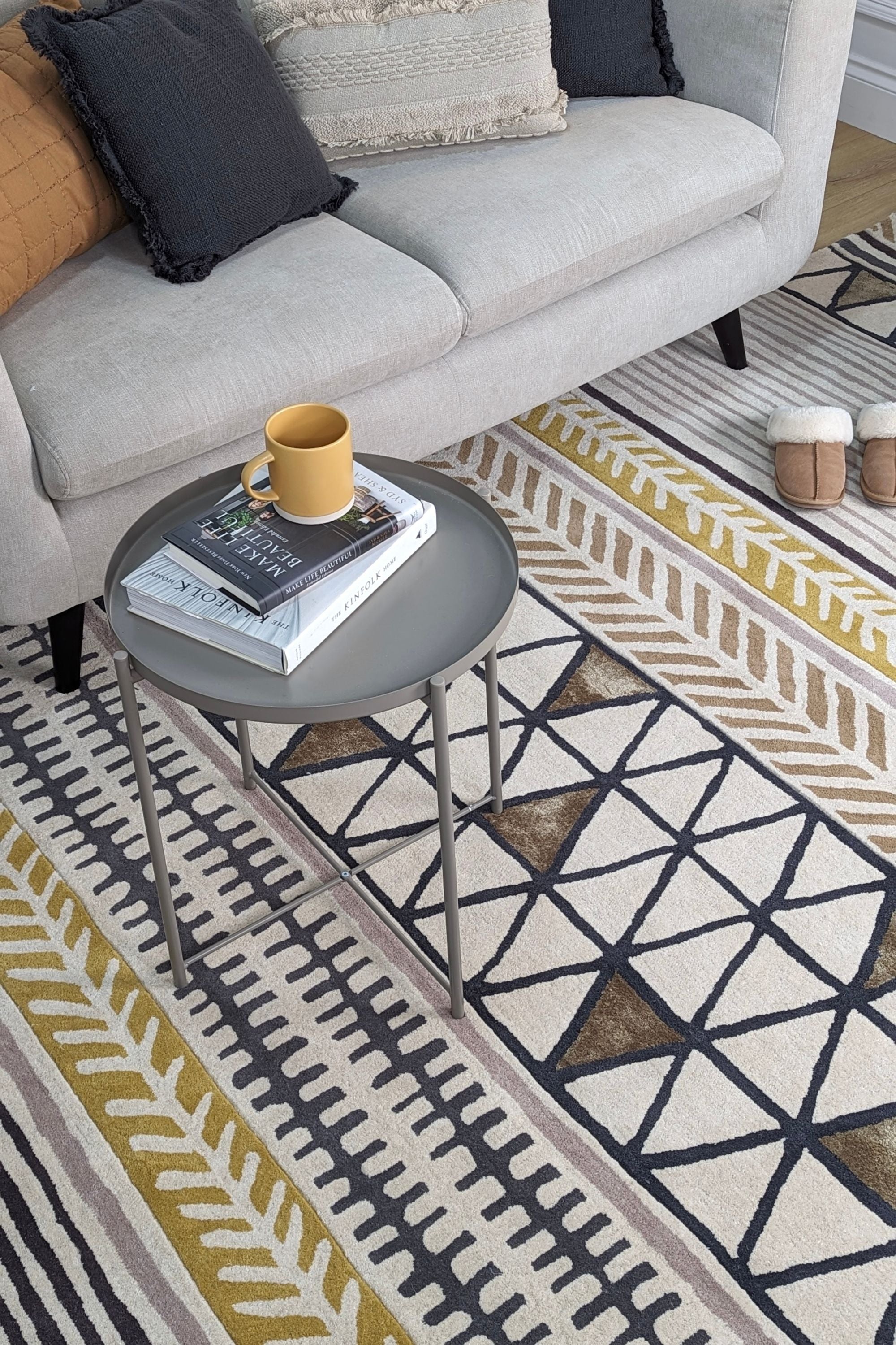 Quirky ethnic inspired pattern in yellow, taupe, cream and grey