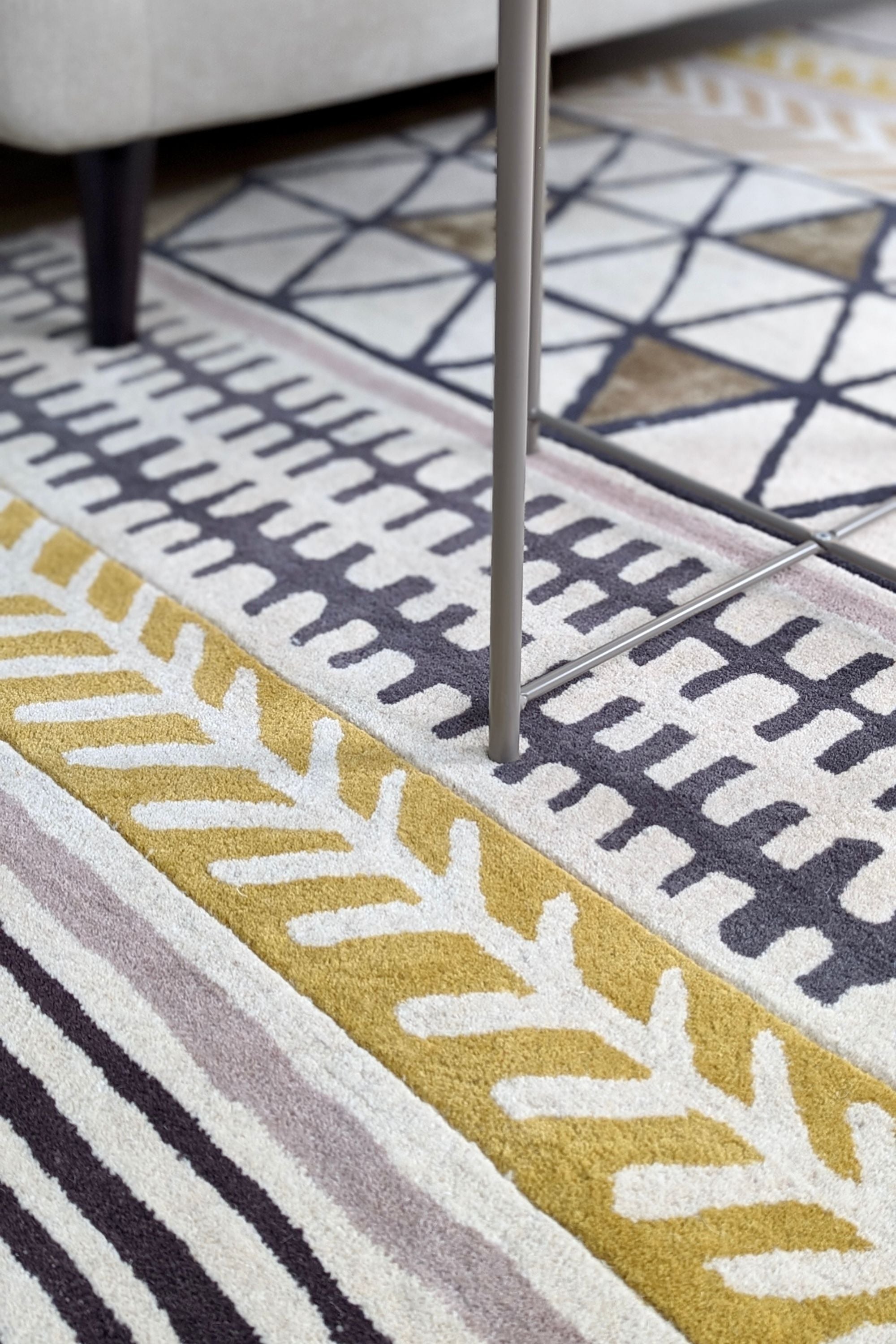 Quirky ethnic inspired pattern in yellow, taupe, cream and grey