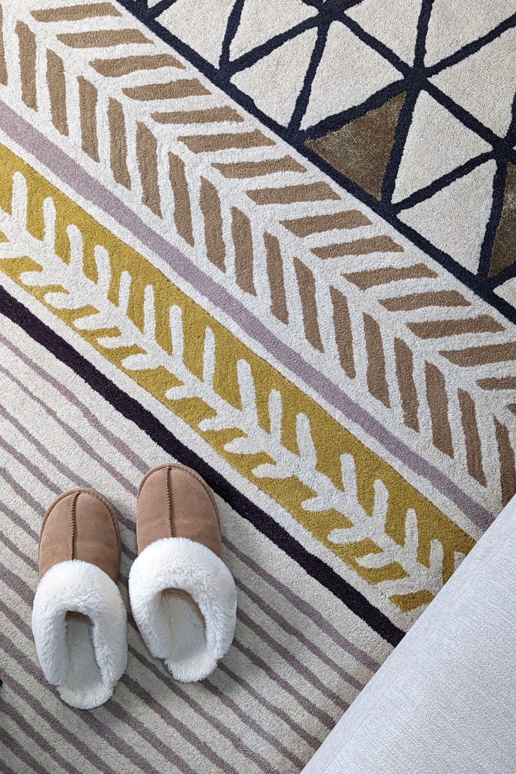 Quirky ethnic inspired pattern in yellow, taupe, cream and grey